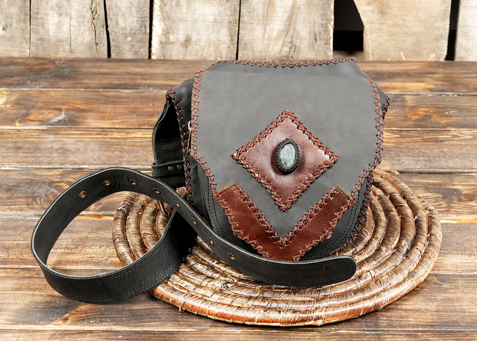 Handmade black & brown leather waist belt pouch with gemstone centerpiece and tribal stitching.