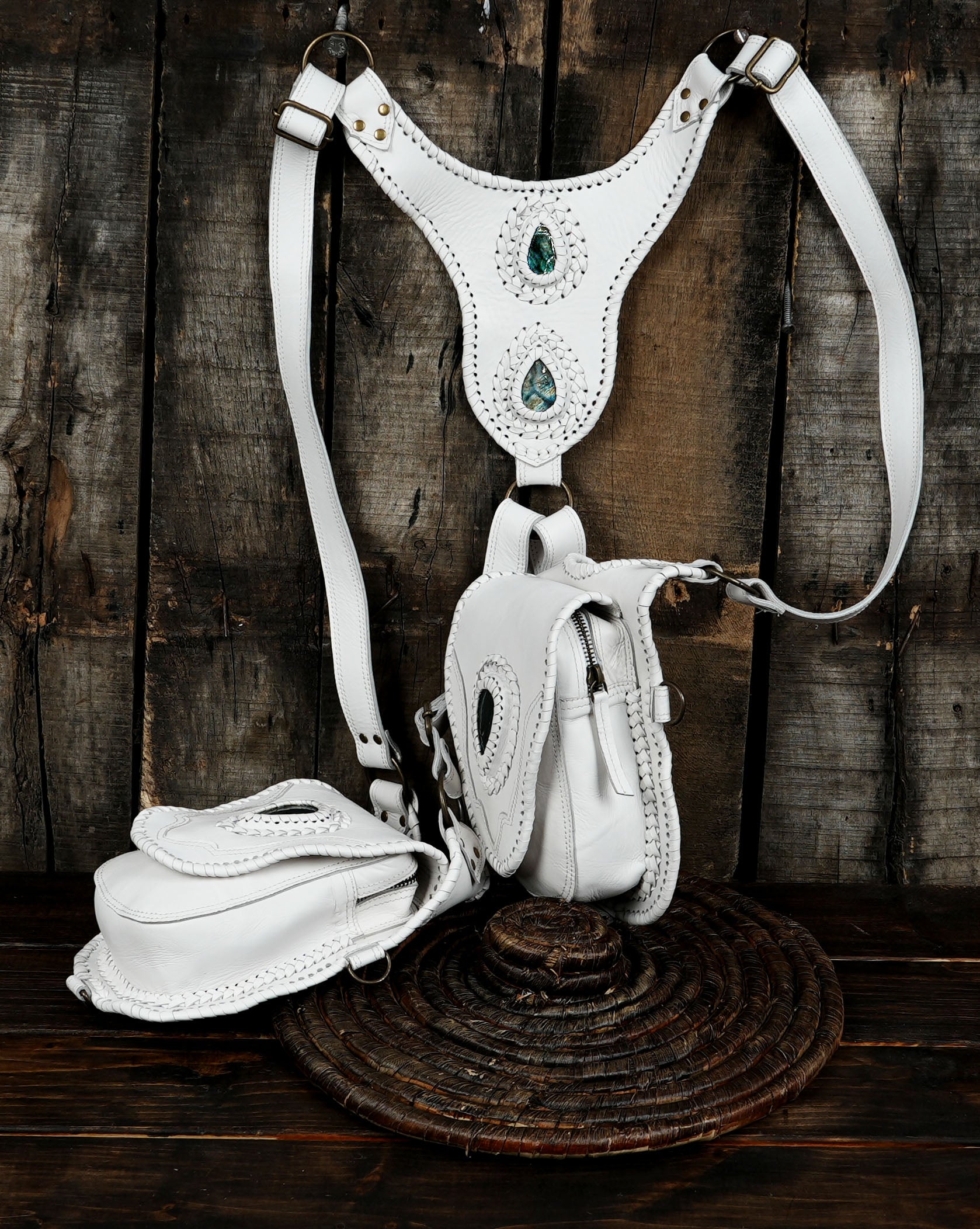 Unique white leather utility harness with gemstone detailing and silver hardware.