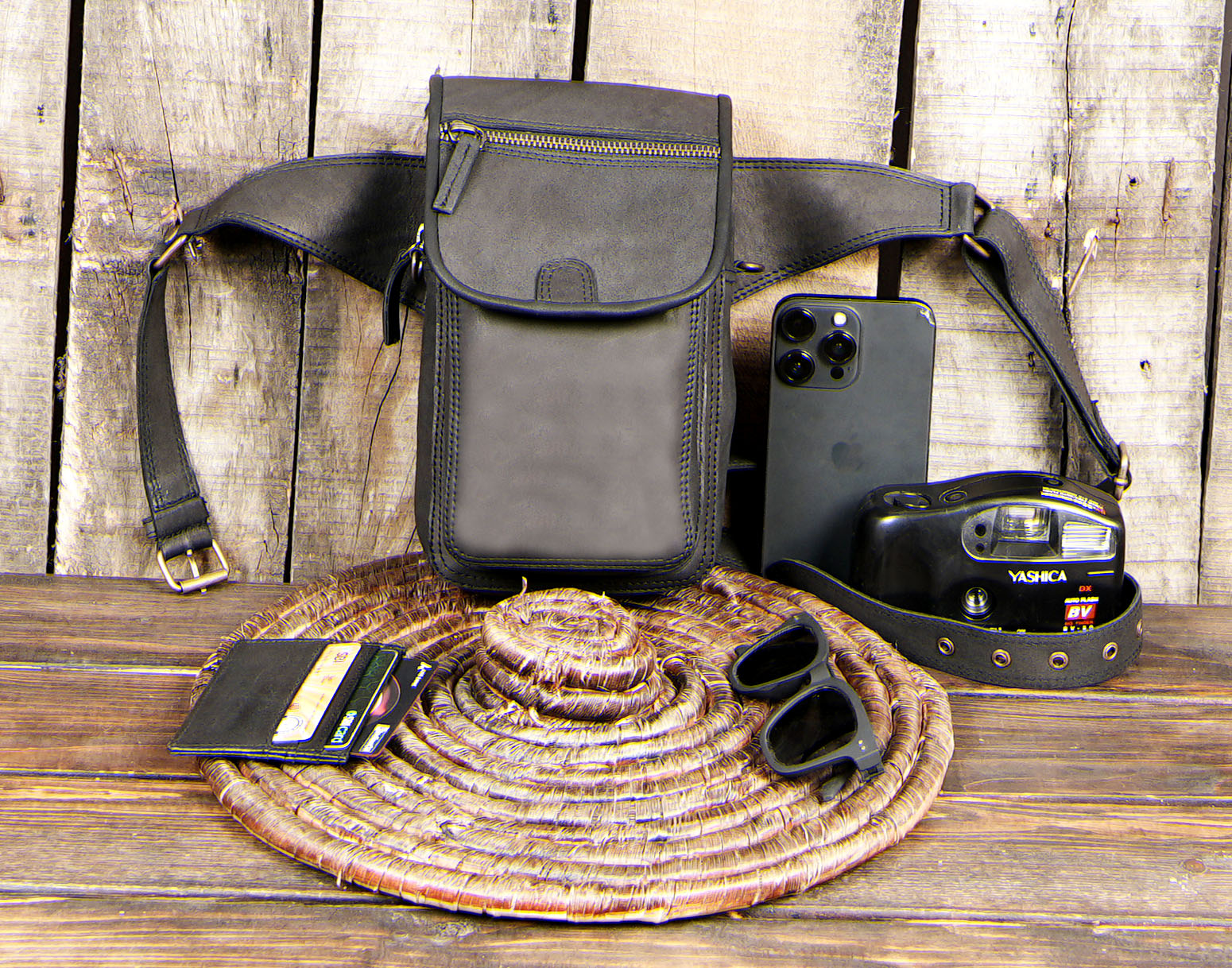 Crafted from high-quality black genuine leather, it features a practical pouch with a zipper and flap closure,