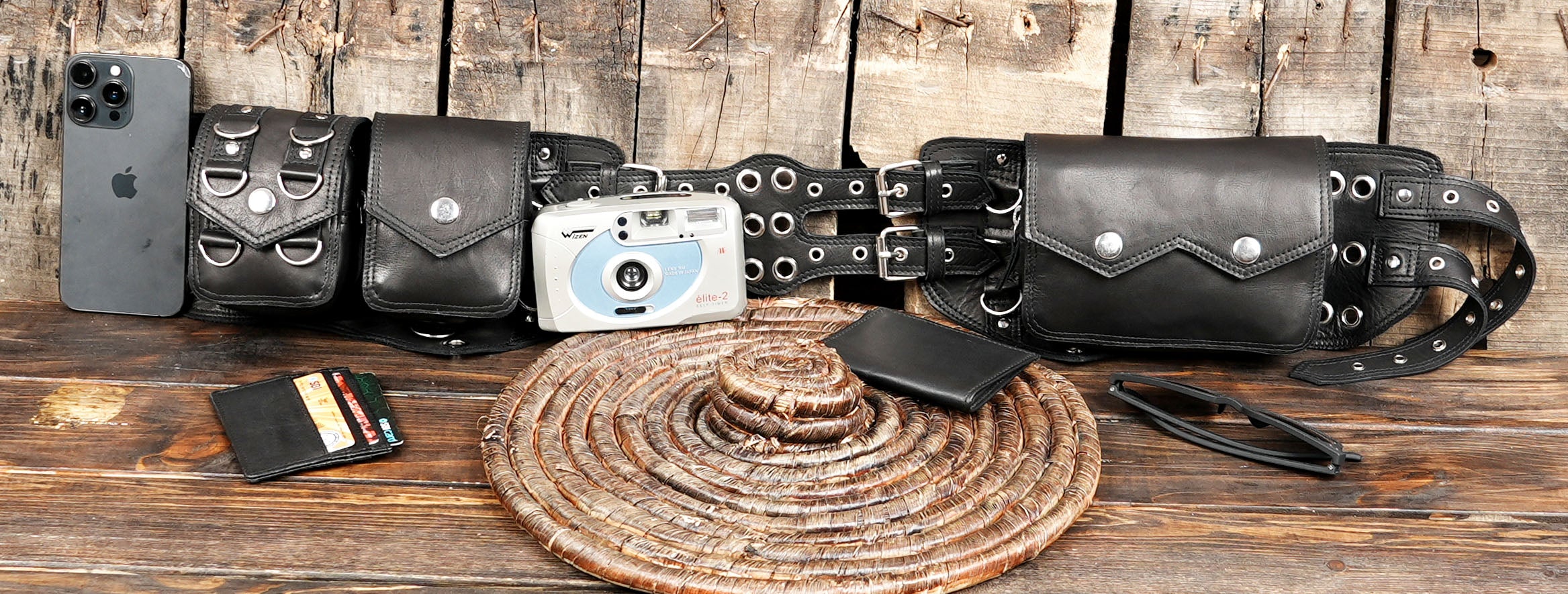 Side view of hip bag on mannequin wearing black pants