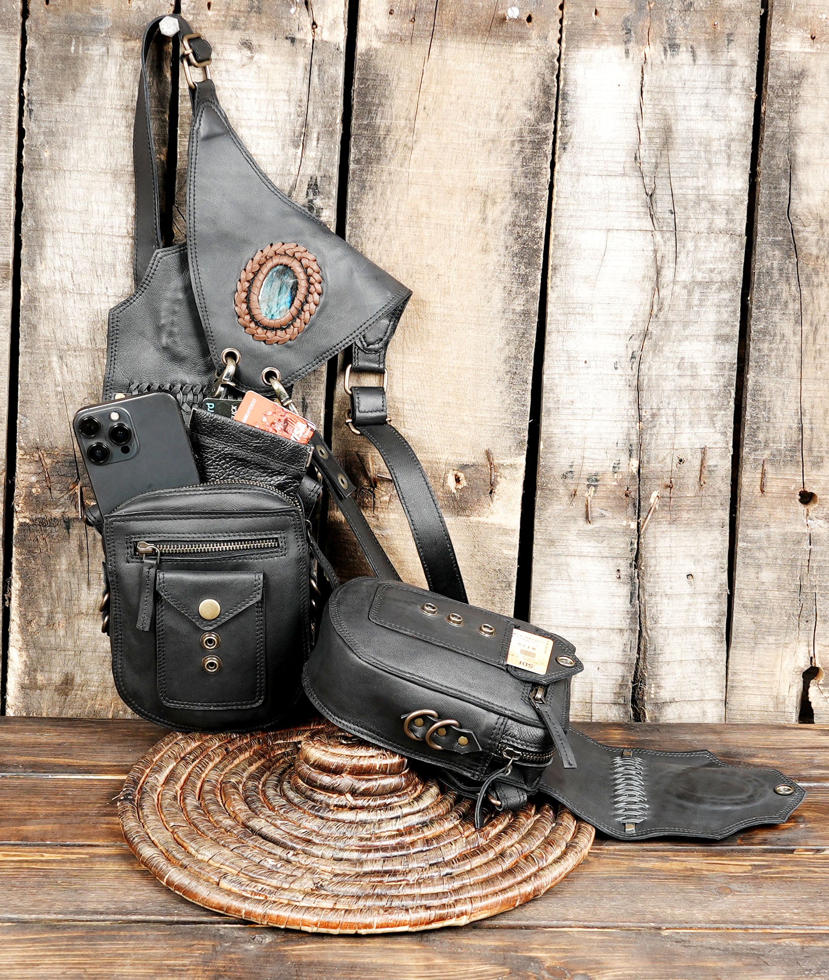 Adjustable black leather shoulder holster with gemstone detail
