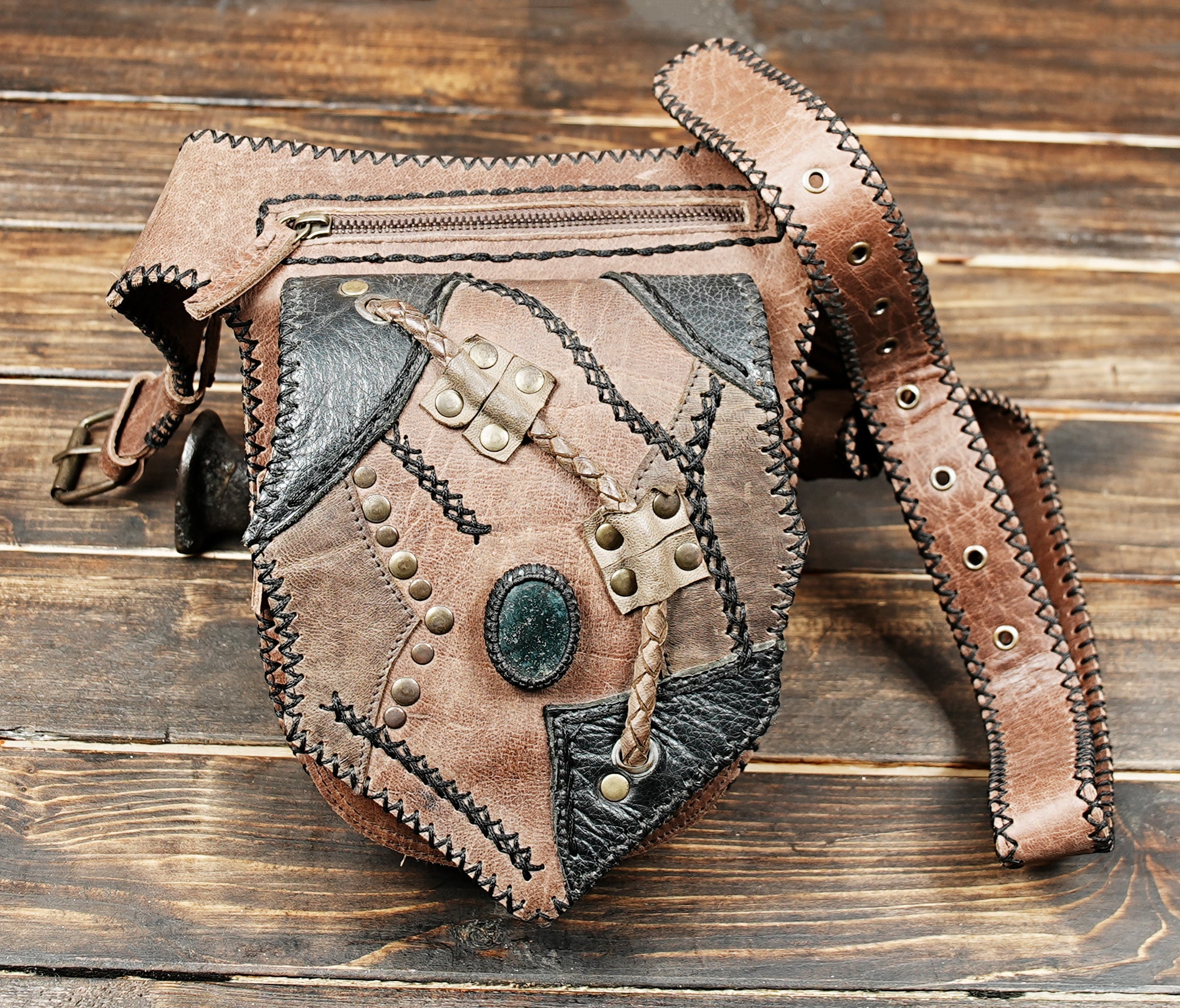 Bohemian leather fanny pack with gemstone detail and rustic stitching