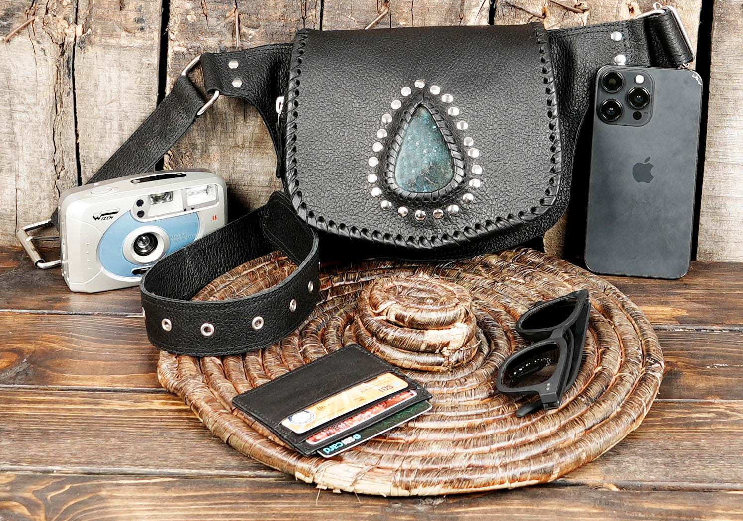 Unique boho-style leather waist bag with gemstone centerpiece and rustic stitching