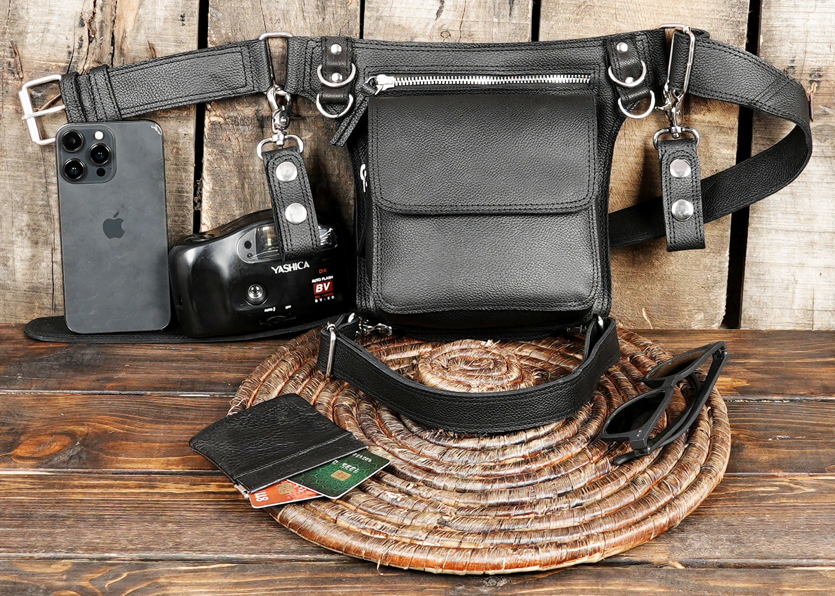 Black leather thigh holster bag designed for travel and outdoor use.