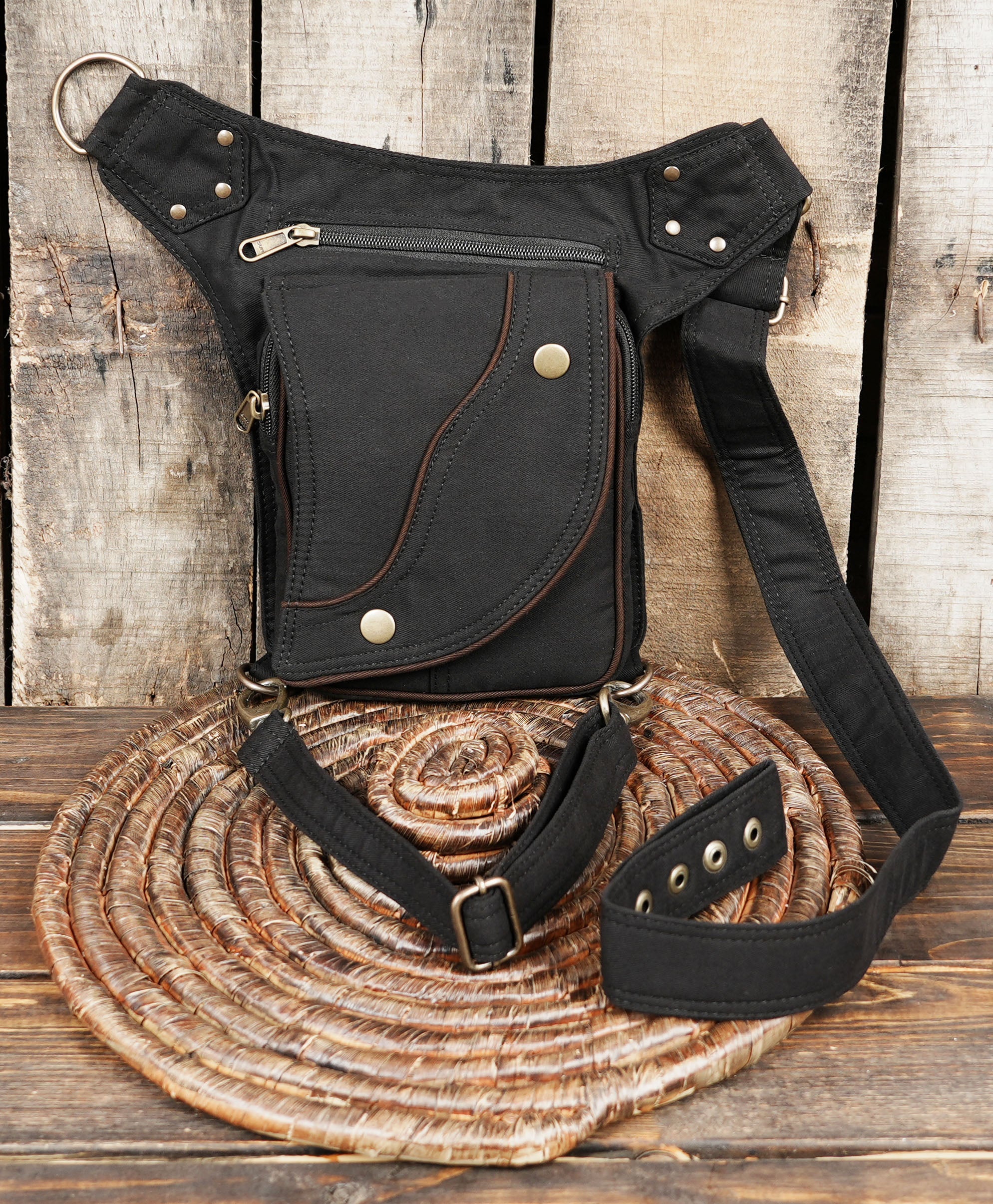Black cotton waist bag styled for festivals and outdoor use