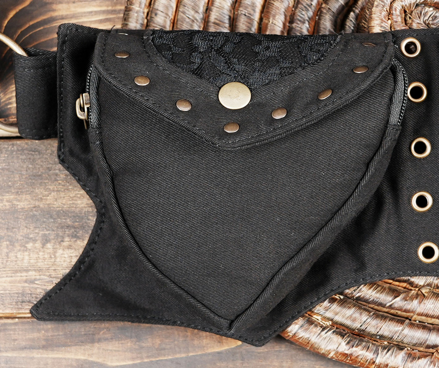 Black canvas waist bag with gold metal studs and zippers