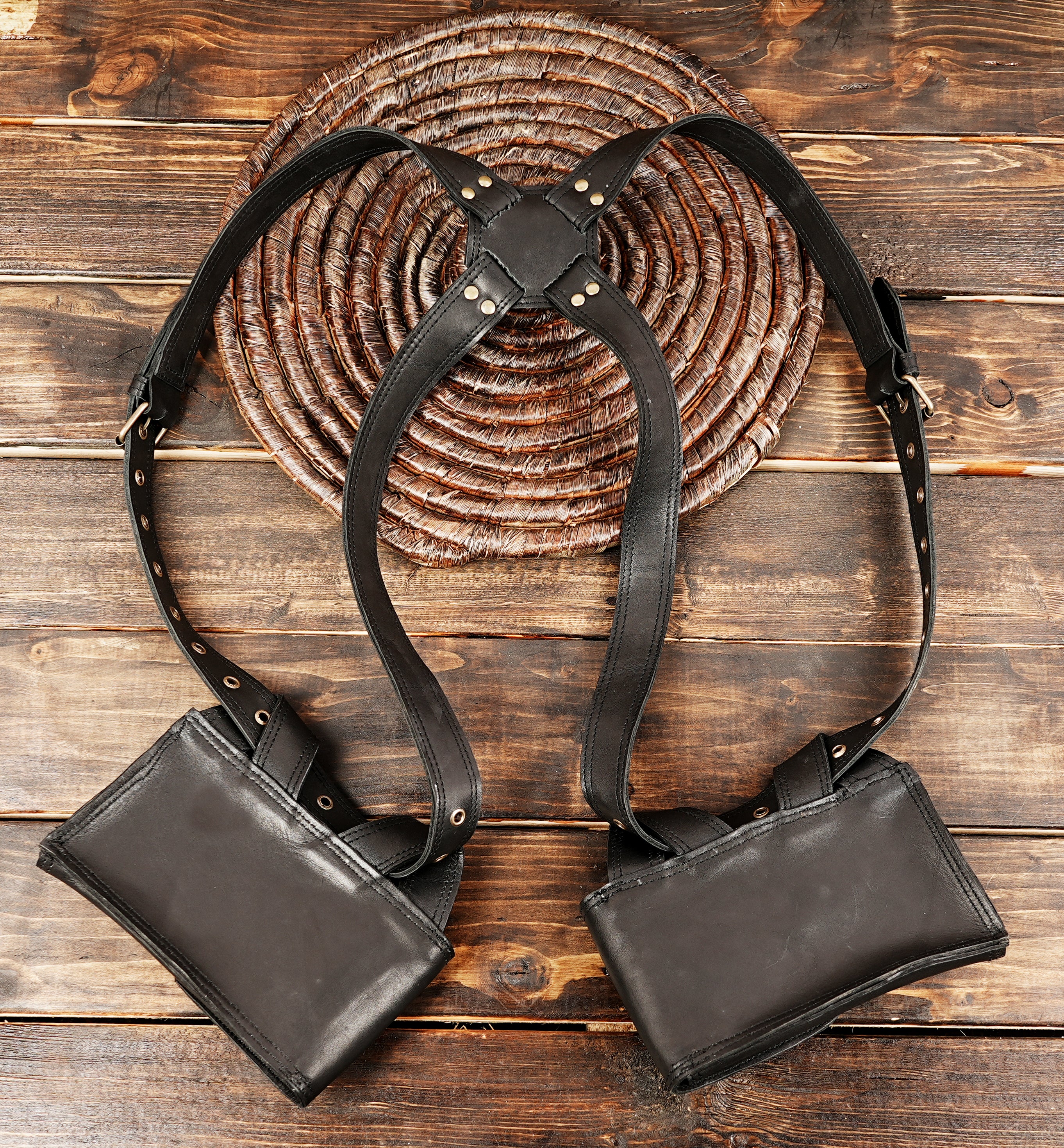 Handmade black leather festival holster with skull hardware