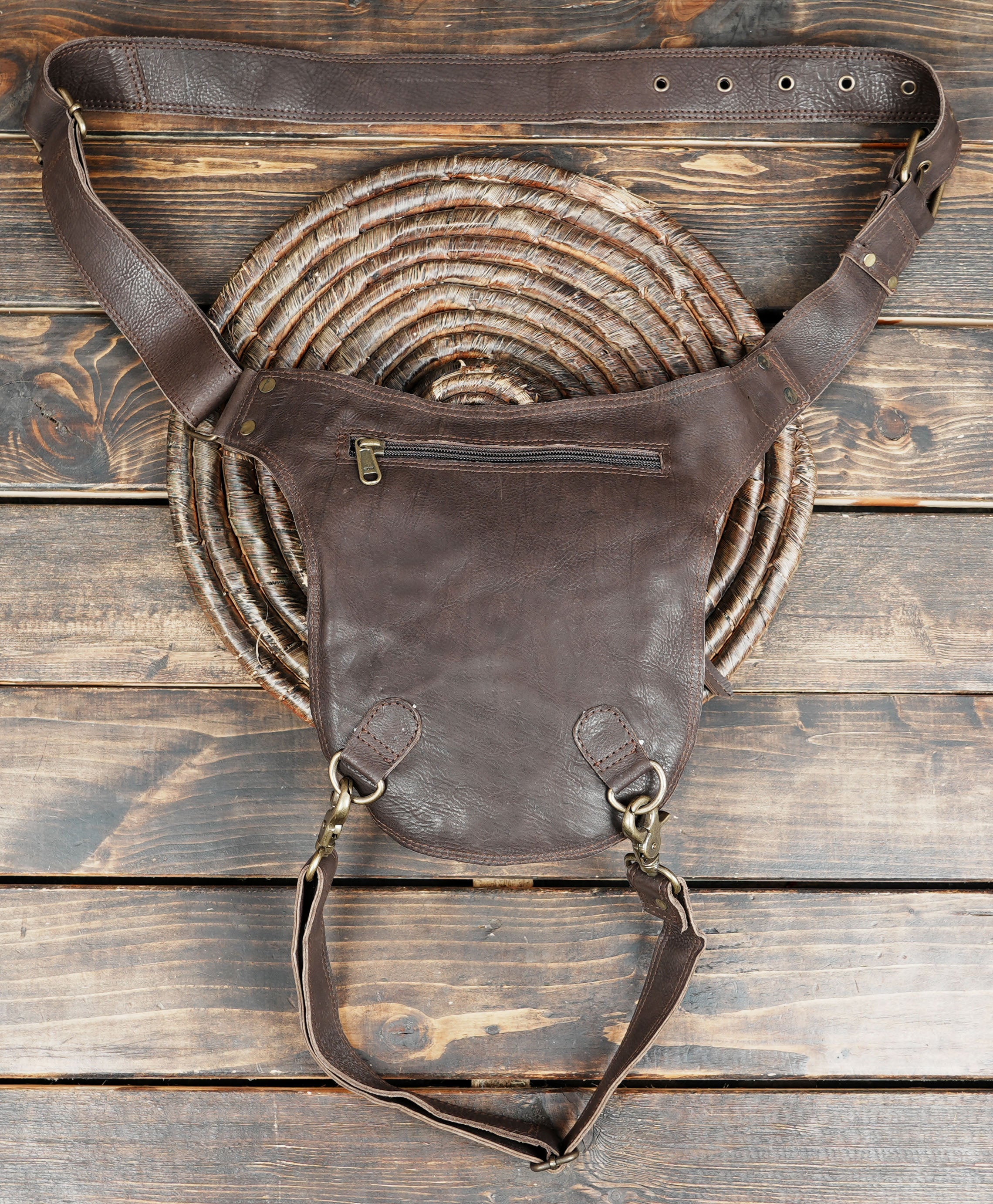 Brown biker thigh bag with durable hardware and rivets