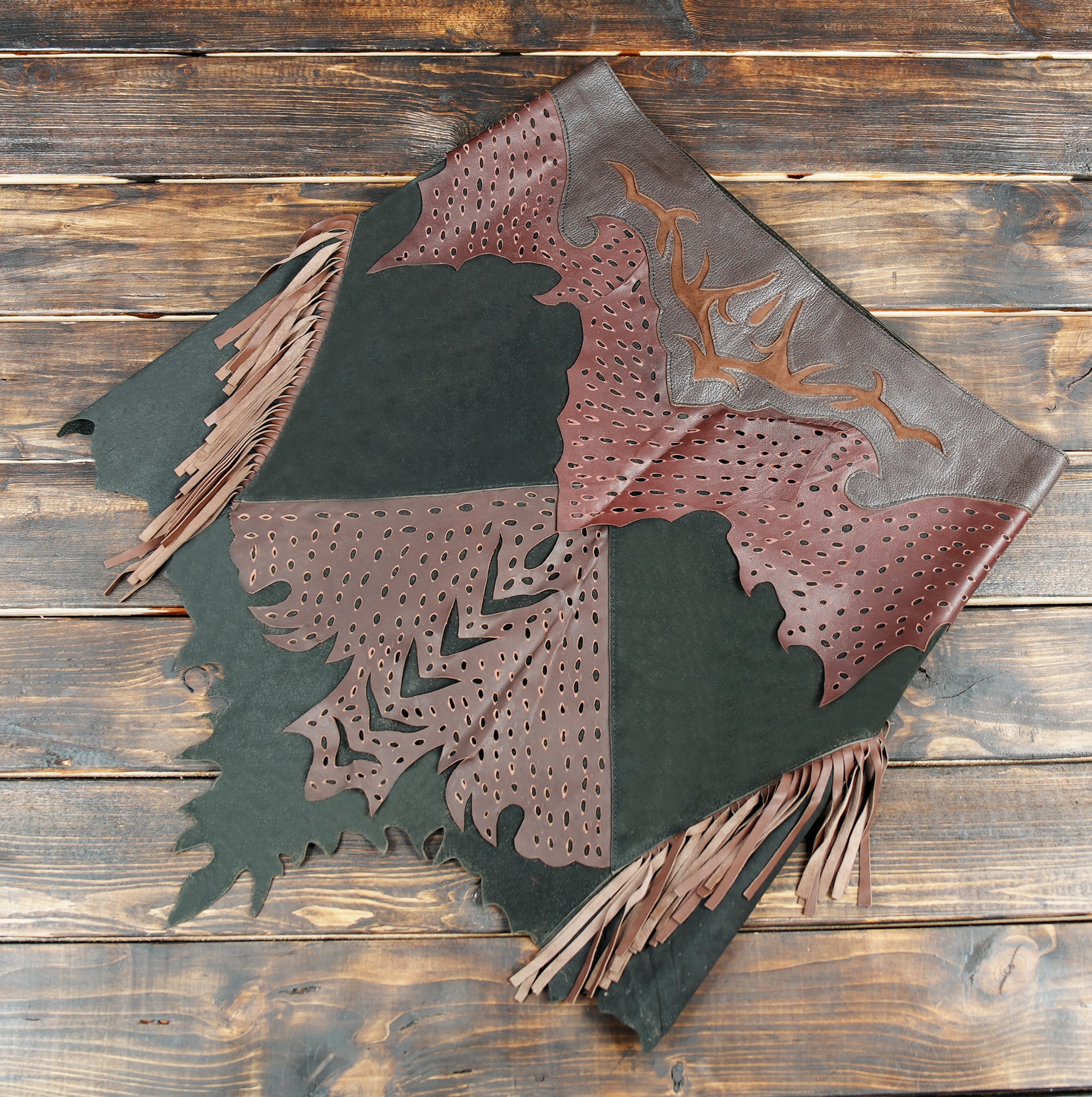 Unique boho leather skirt with asymmetrical hem and perforated details