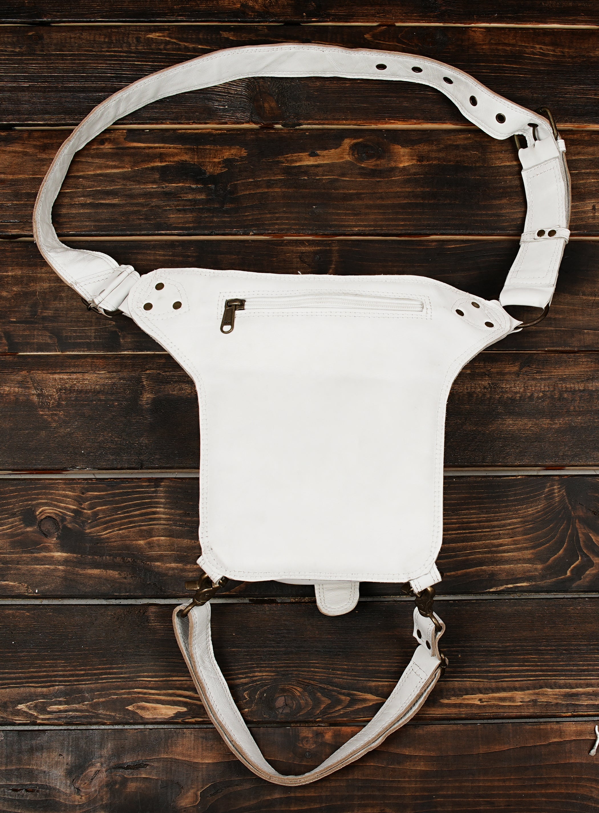 Utility leather festival bag with riveted front design in white