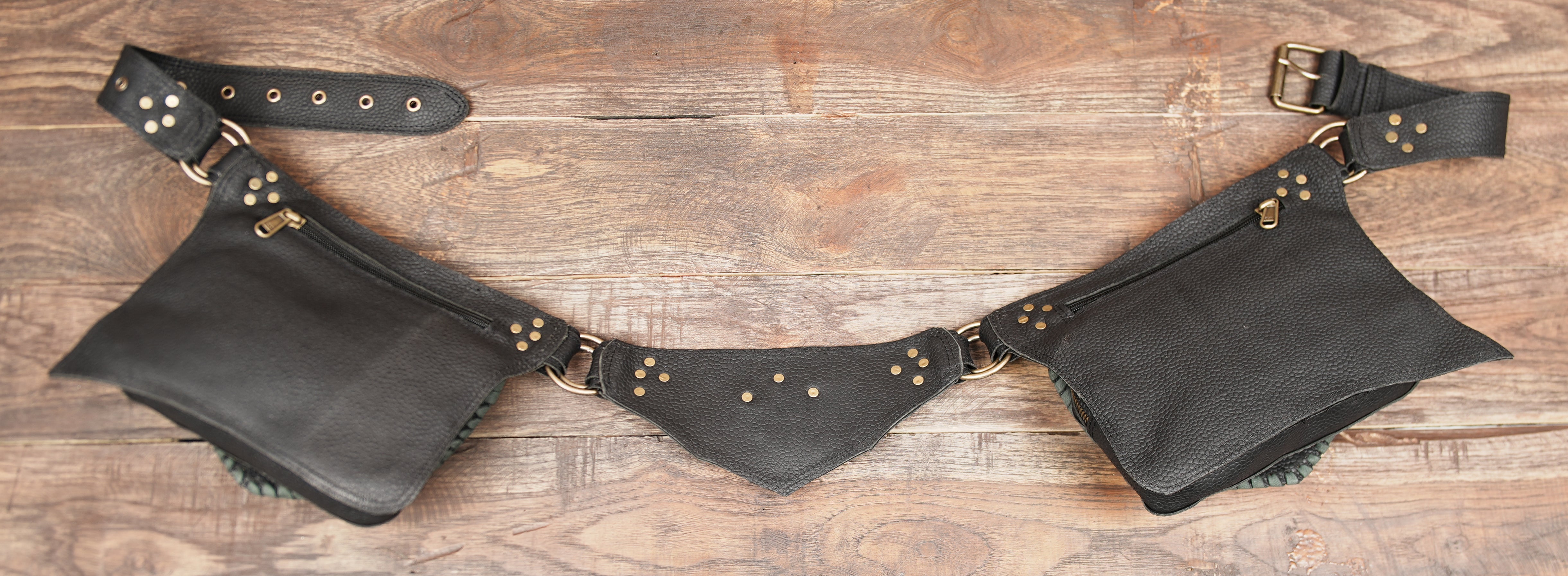 Handmade gemstone leather utility belt worn over patterned leggings