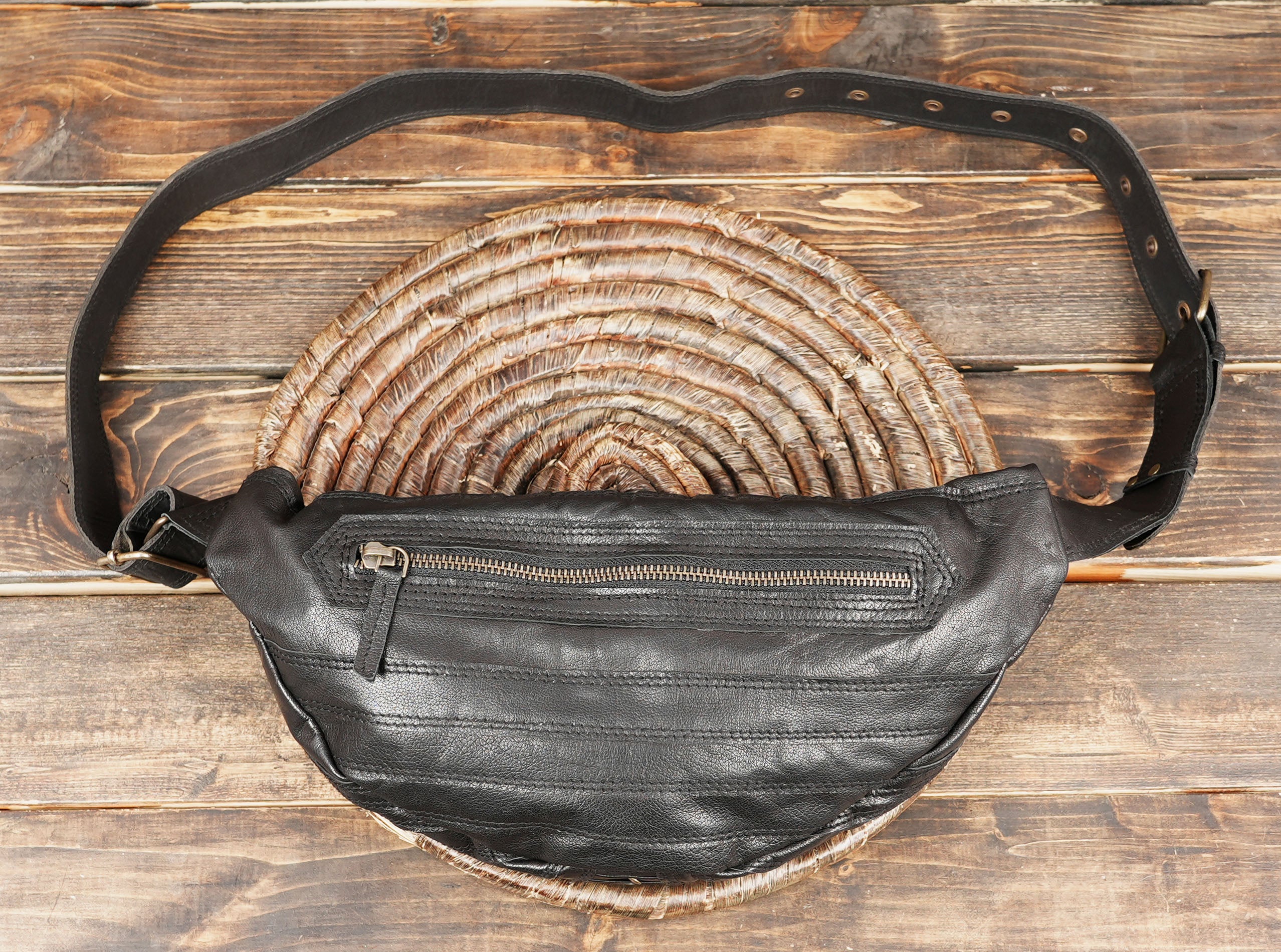 Stylish leather shoulder holster bag for travel, concerts, and festivals.