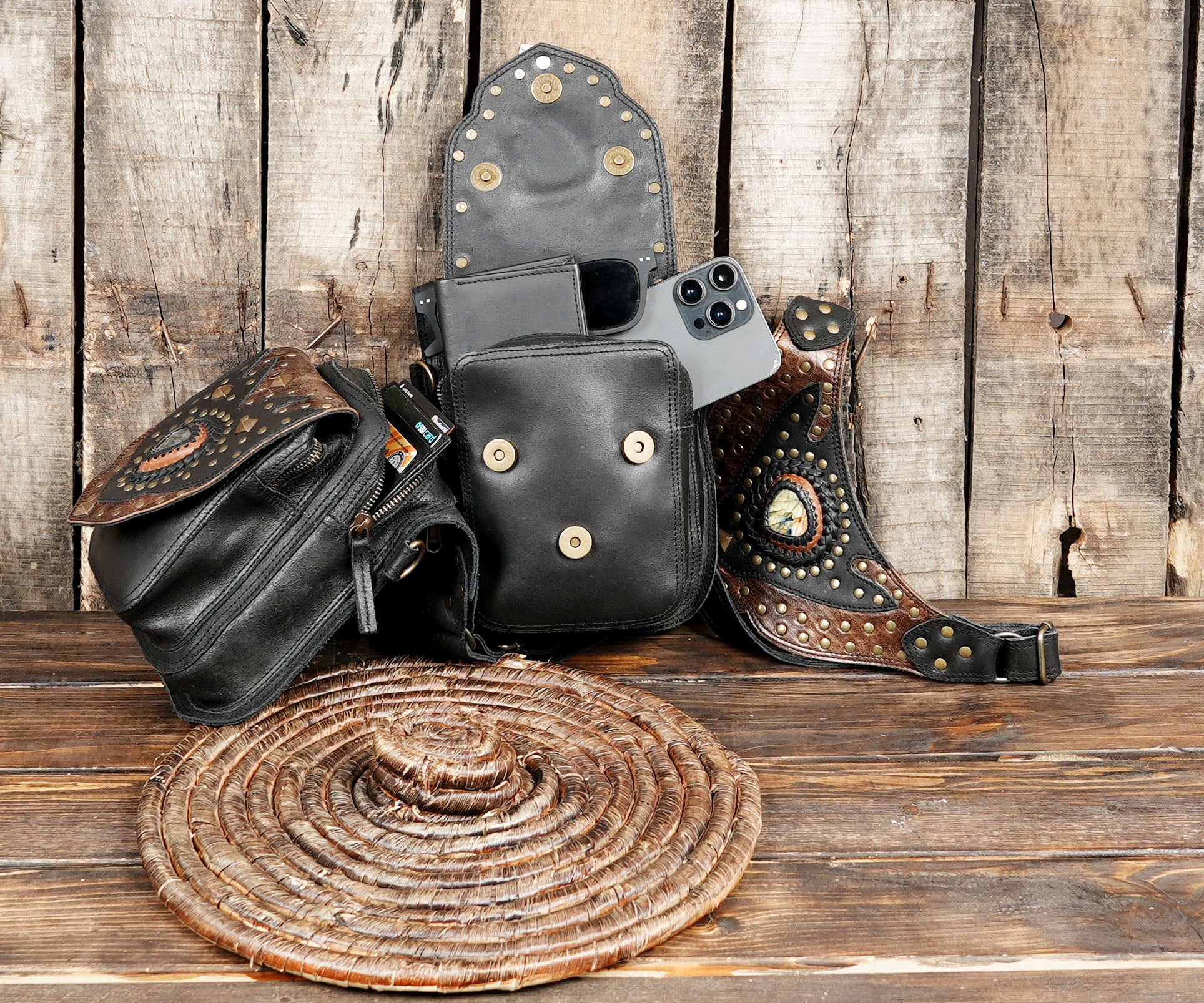 Made from premium black and brown leather, it features intricate gemstone embellishments, tribal-inspired detailing, and sturdy rivets.
