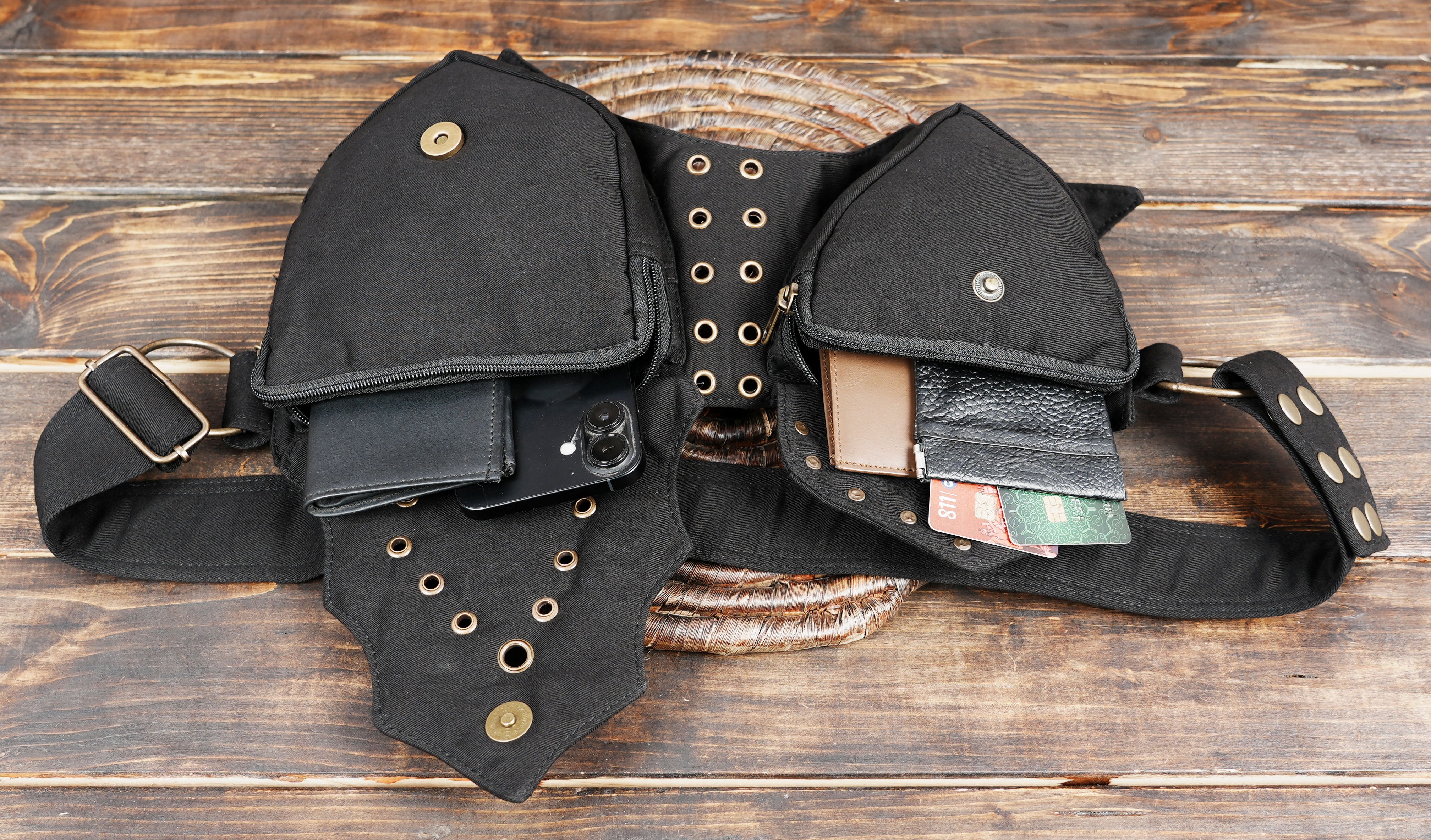 Edgy black hip pouch with lace detailing and metallic rings