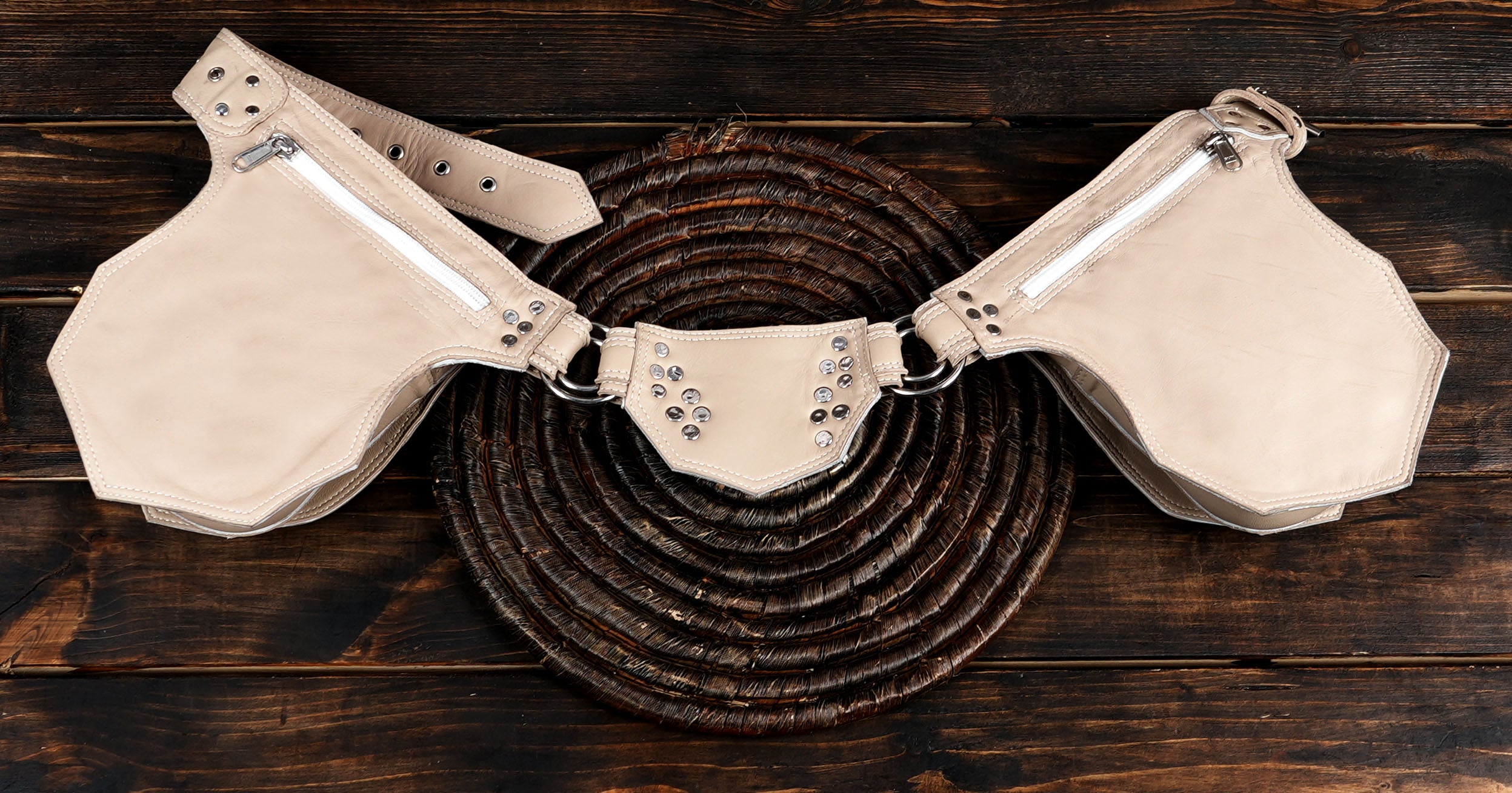 Festival-ready cream leather pouch belt with rugged metal accents