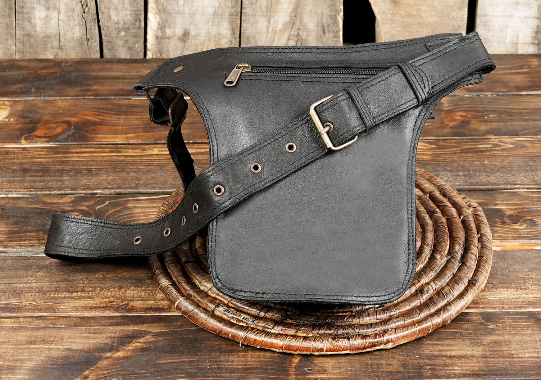Handcrafted leather waist pack with gothic rivet accents
