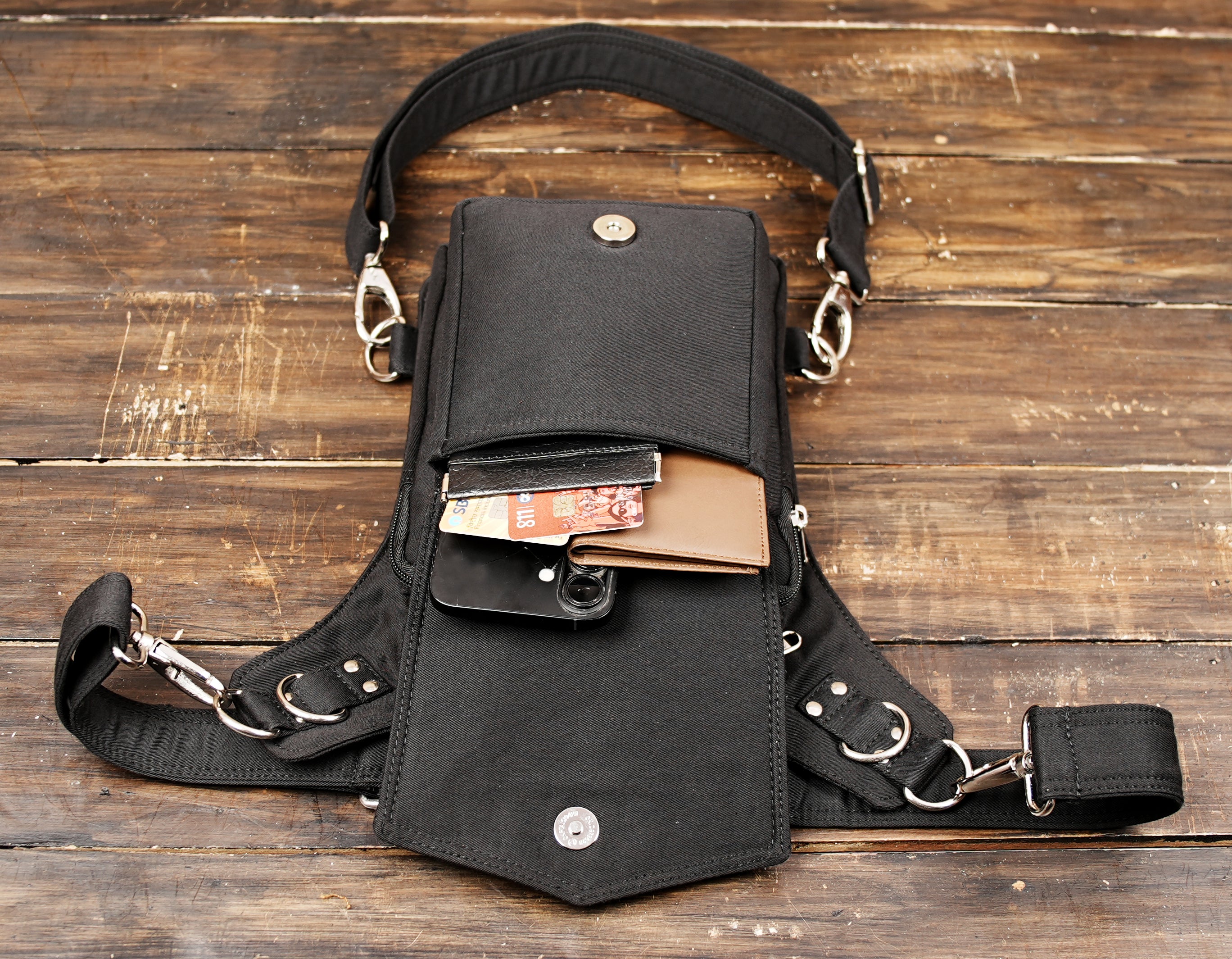 Cotton waist thigh utility bag styled on mannequin with black pants
