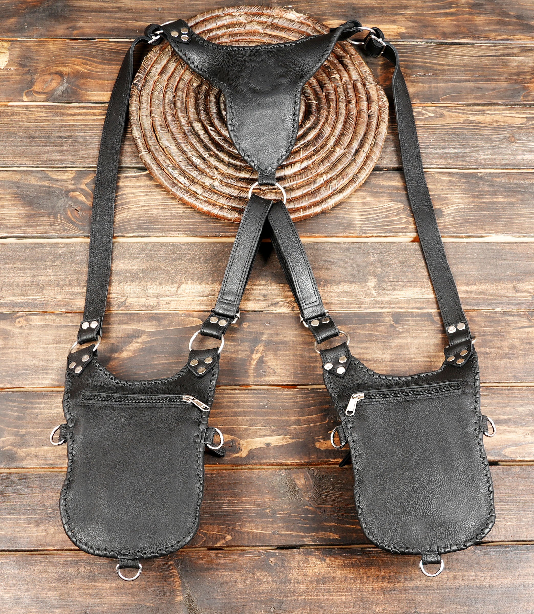 Steampunk-style black leather holster bag with metal ring connectors