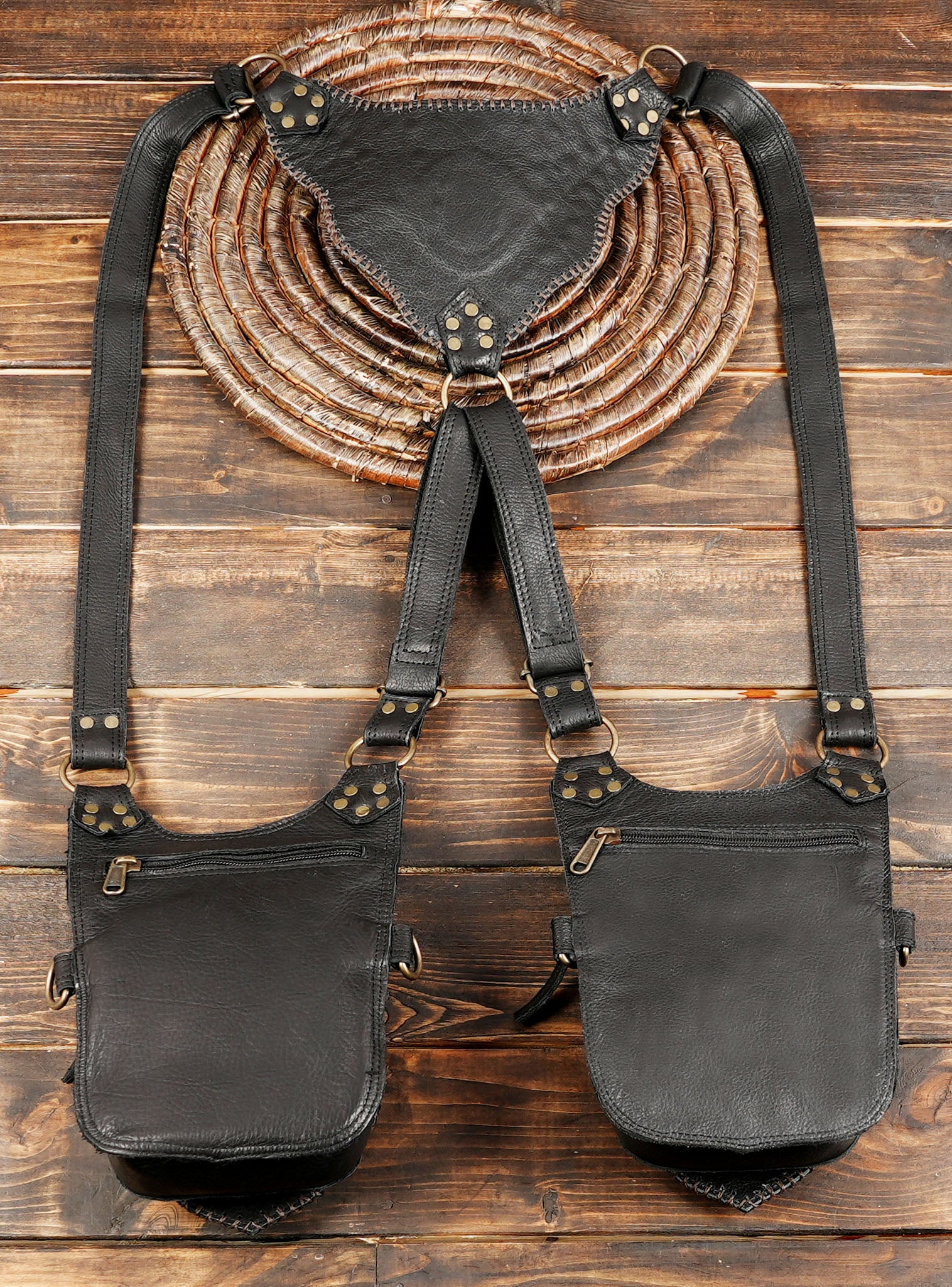 Black leather holster harness with decorative gemstone centerpiece