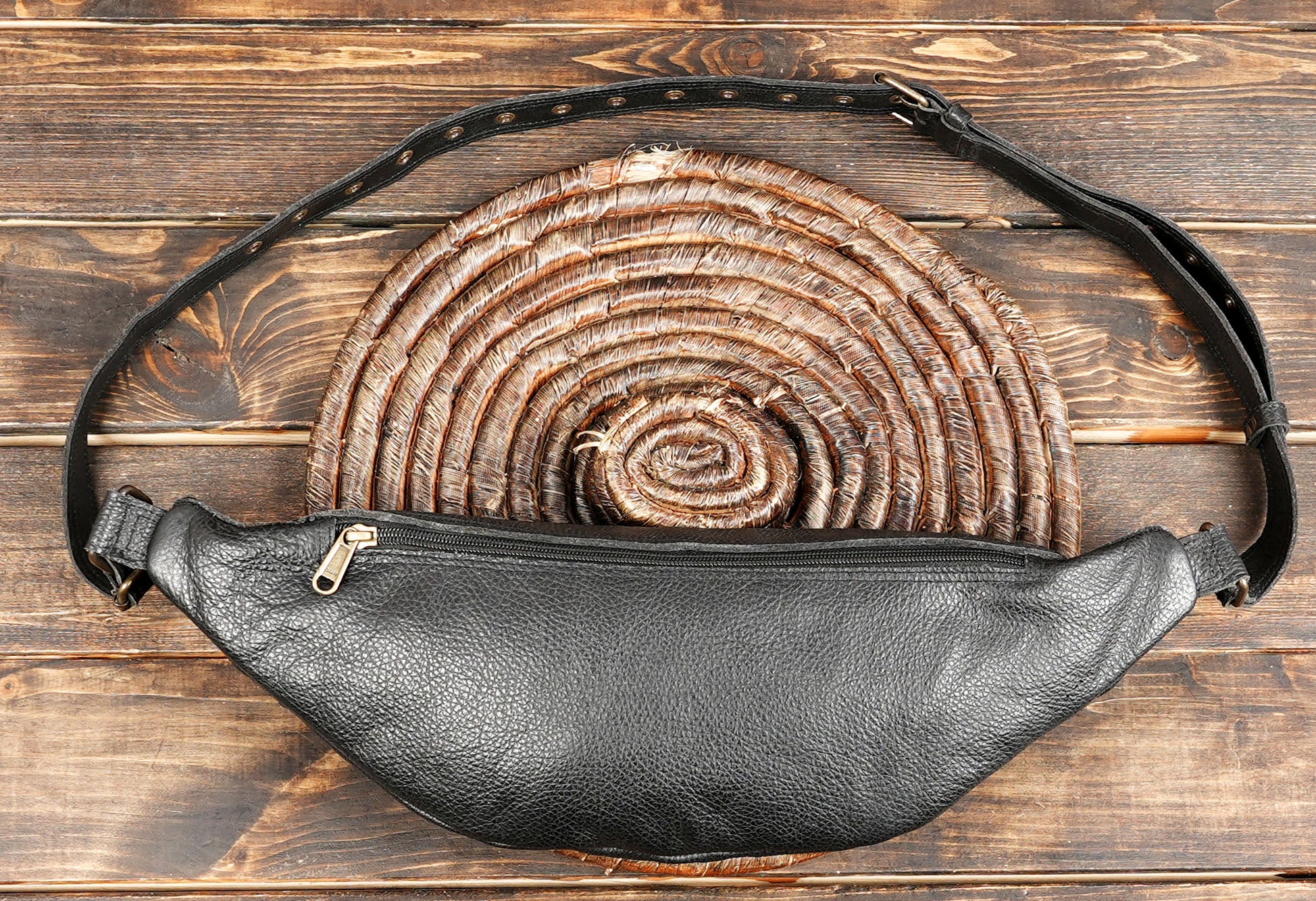 Versatile black leather belt bag for hands-free carrying