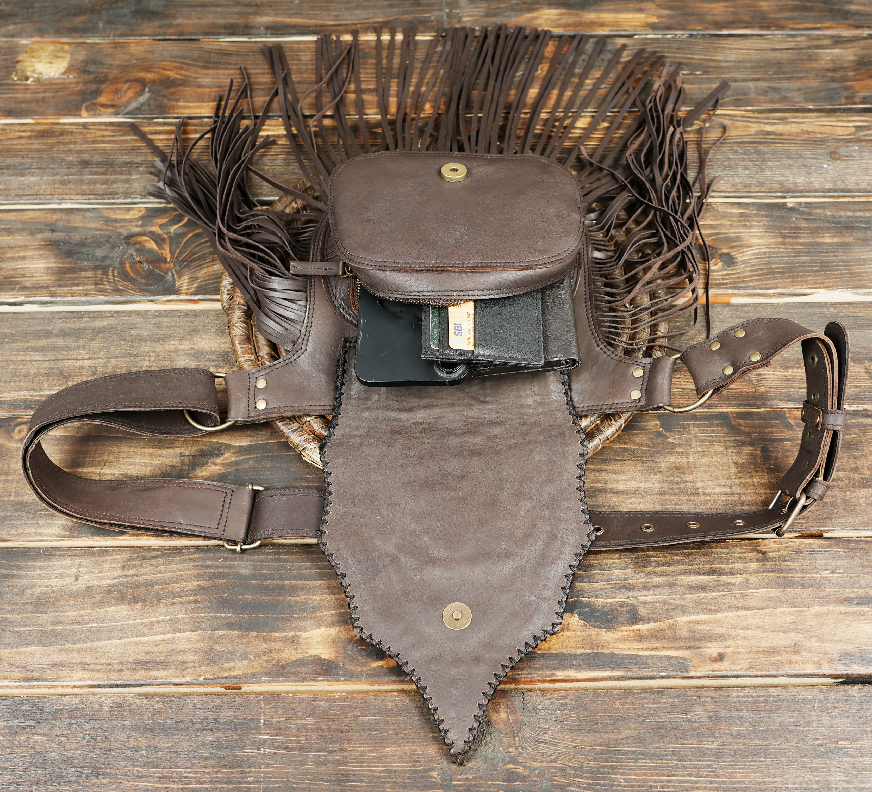 Western style waist bag with decorative studs and tassels