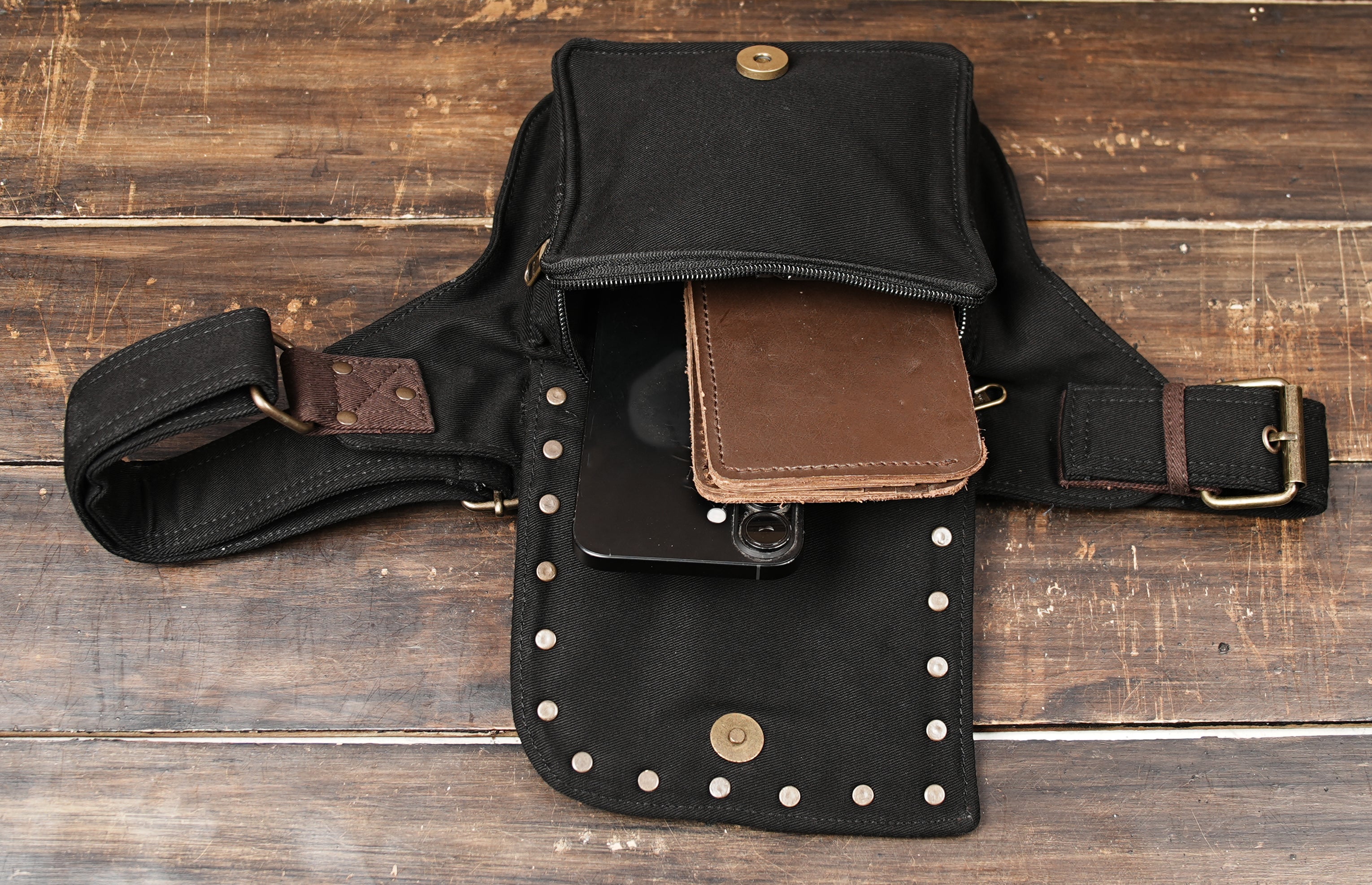 Model wearing black and brown festival hip bag