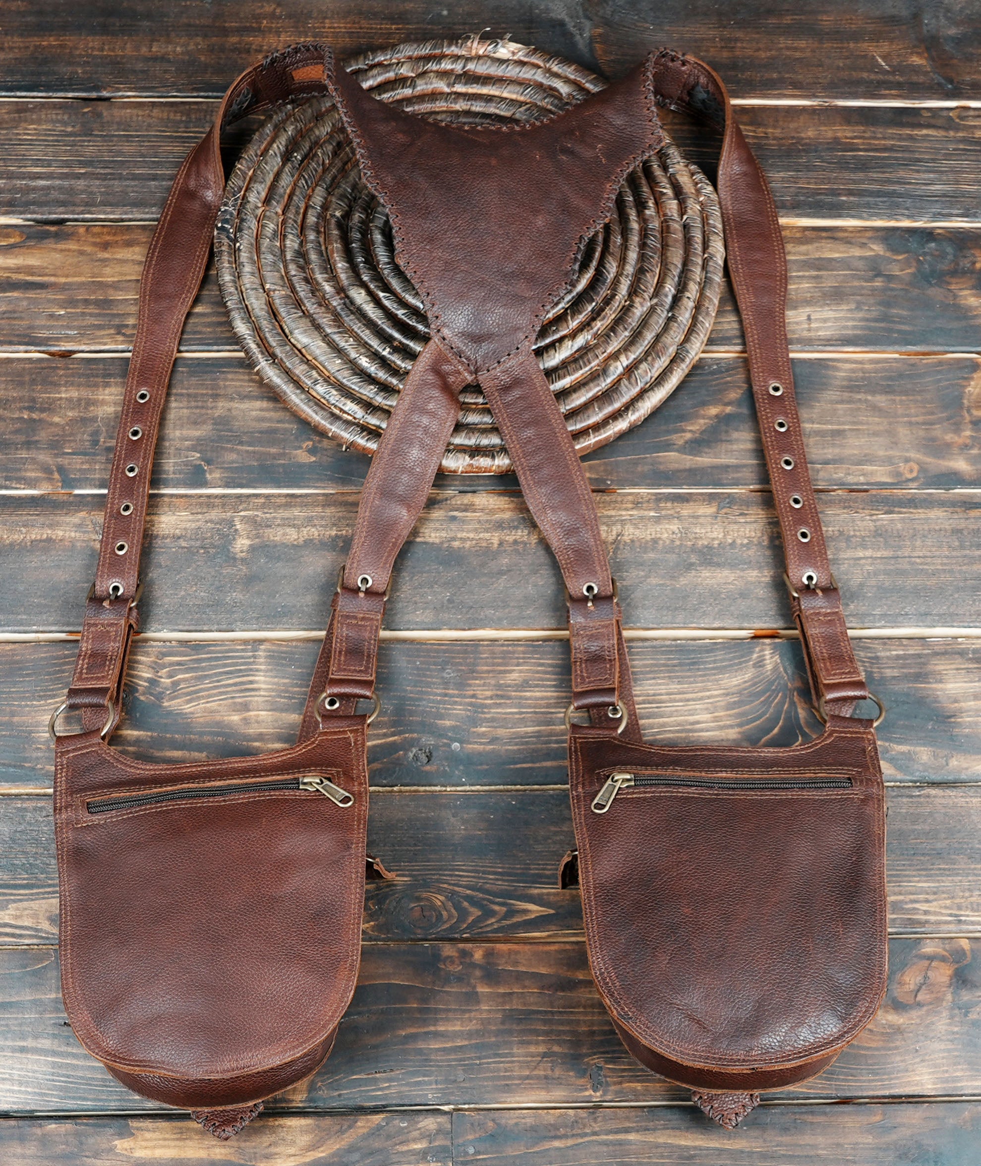 “Western-inspired leather holster with hand-stitched panels and brass studs”
