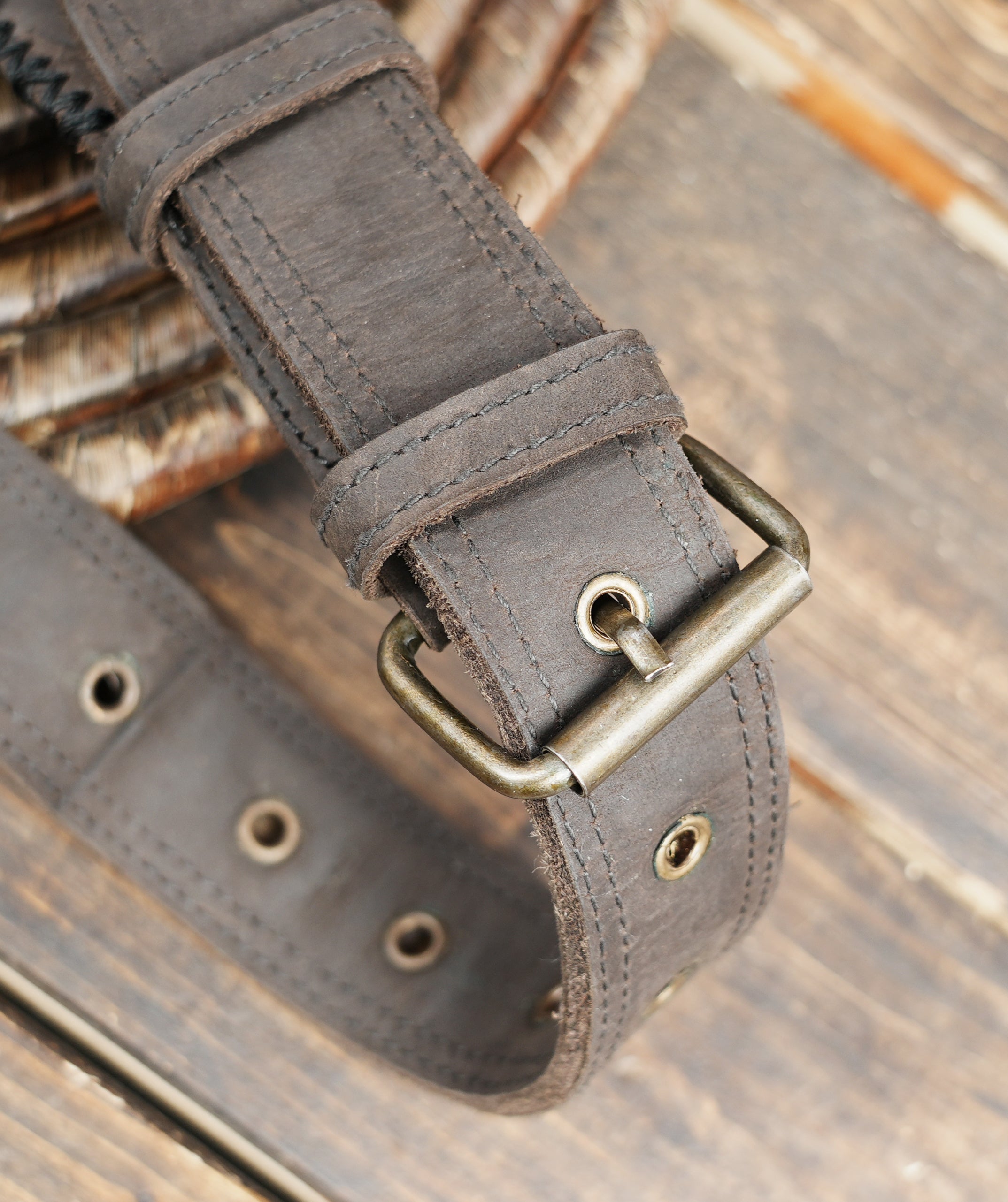 Premium artisan leather hip pouch with reinforced rivet detail