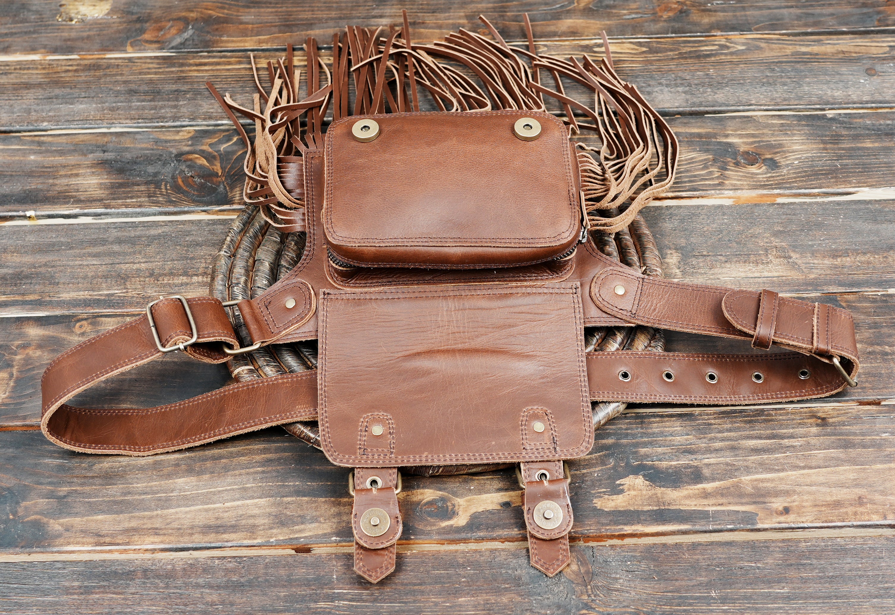 Utility leather festival pouch with long decorative tassels