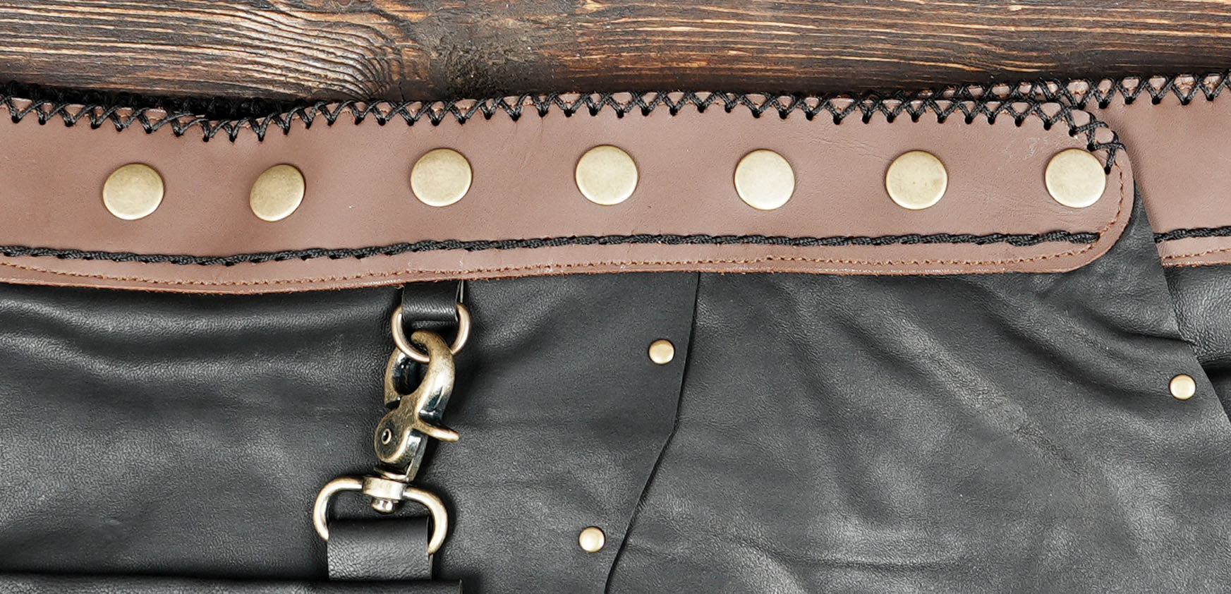 “Artisan Black Leather Skirt with Crochet Design and Stone Embellishment”