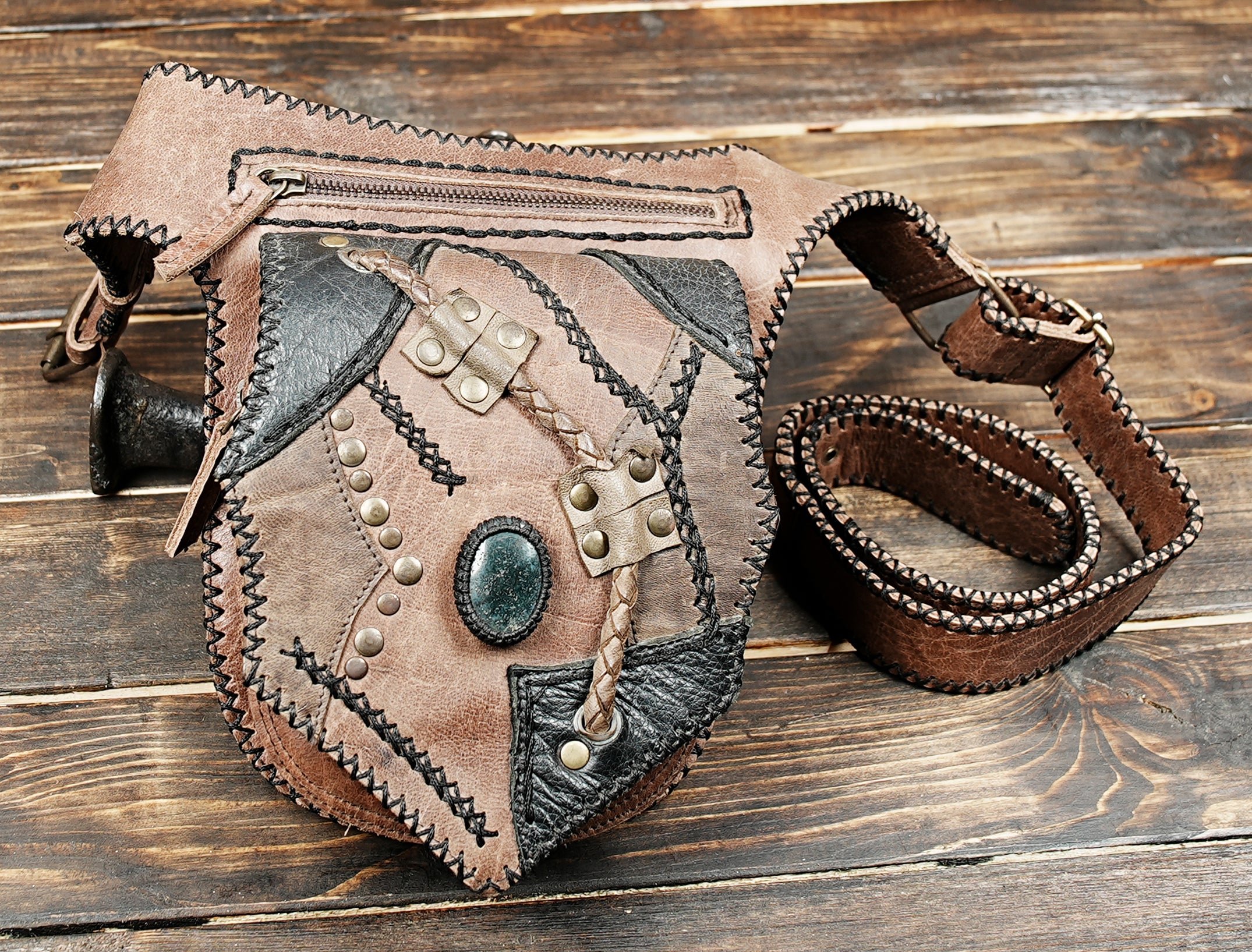 Artisan leather waist pouch with stone centerpiece and brass rivets