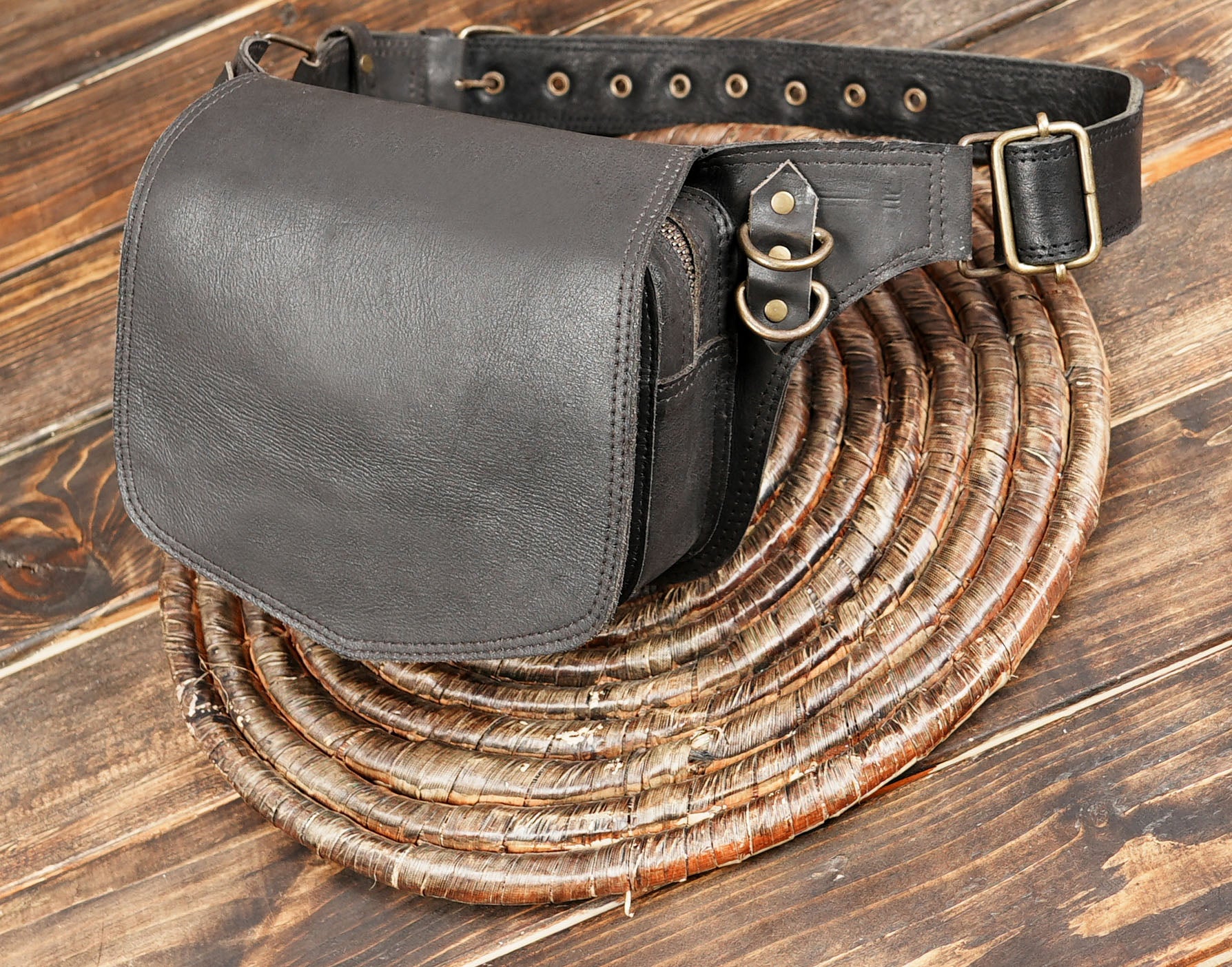 Black leather waist bag with adjustable buckle strap