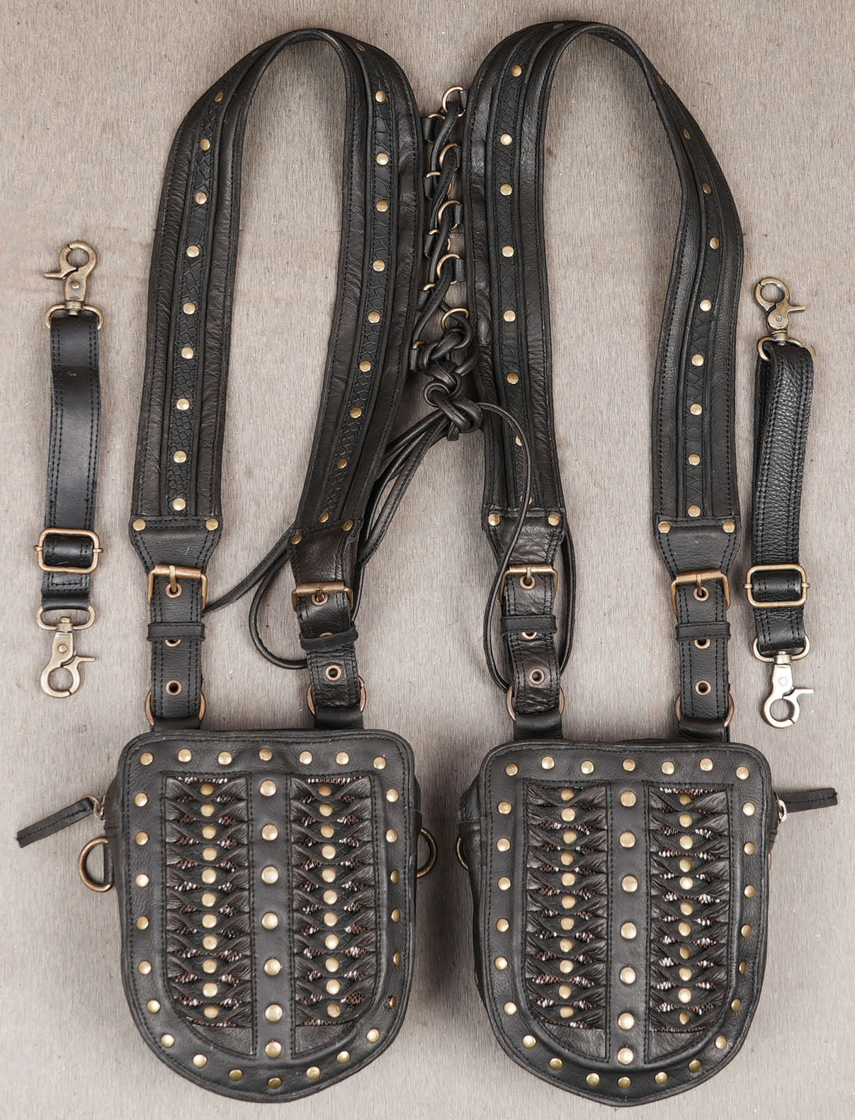 Handmade black leather dual holster with studded detailing and adjustable straps