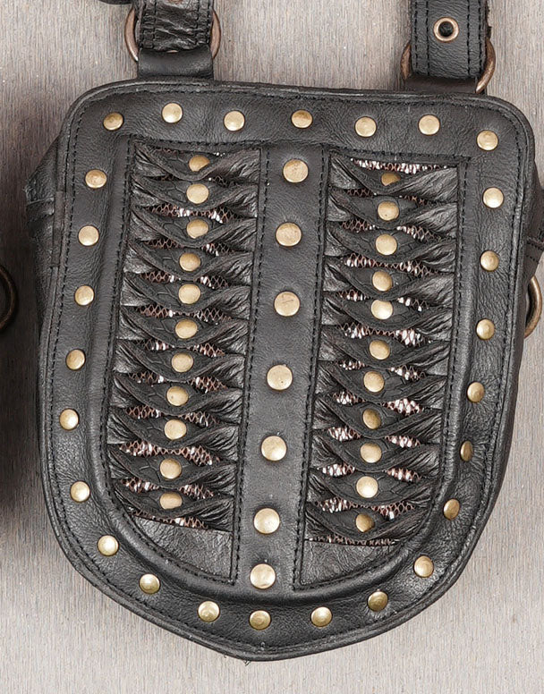 Steampunk leather holster rig with rivets and braided panel design