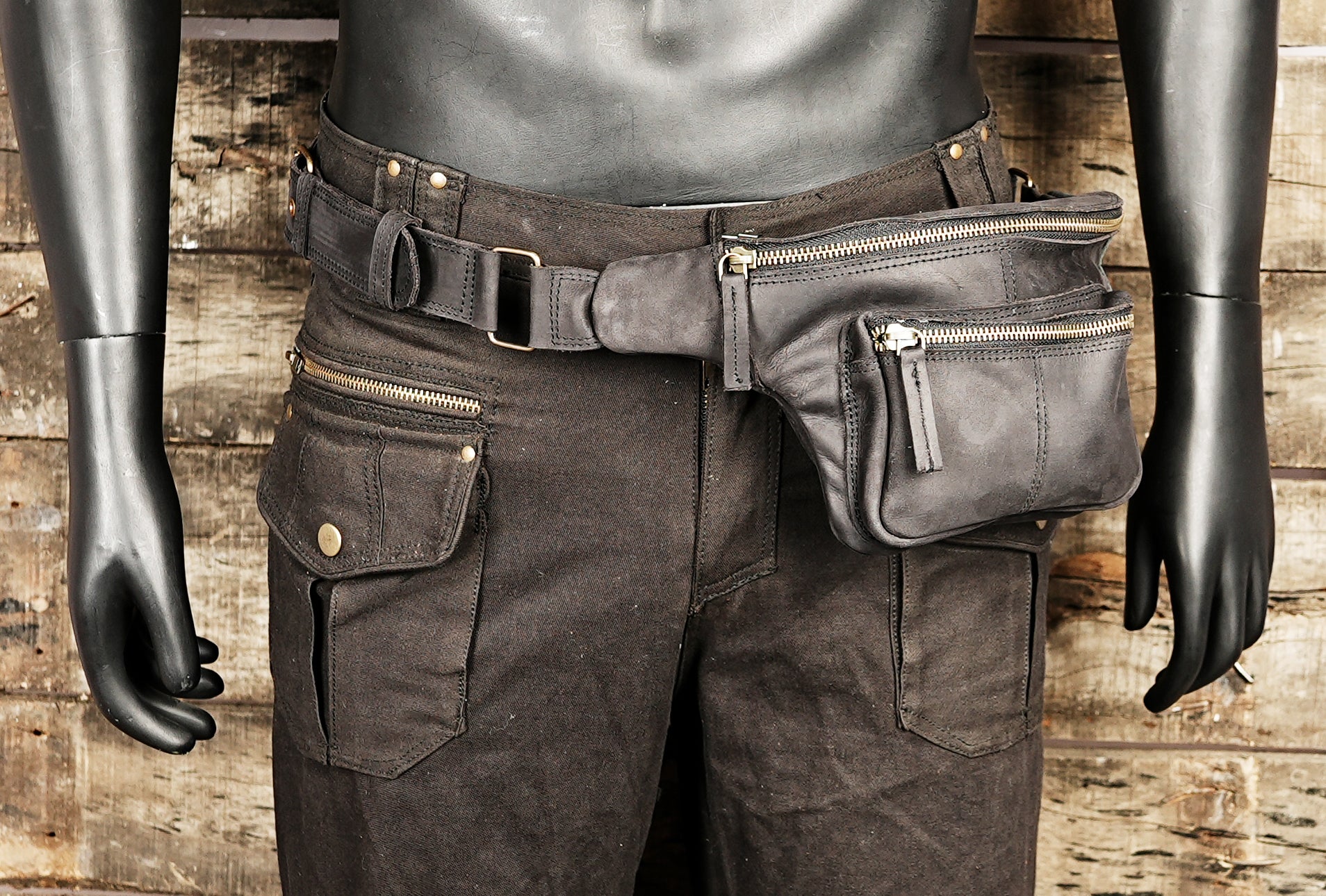 Compact black fanny pack with multiple zippers