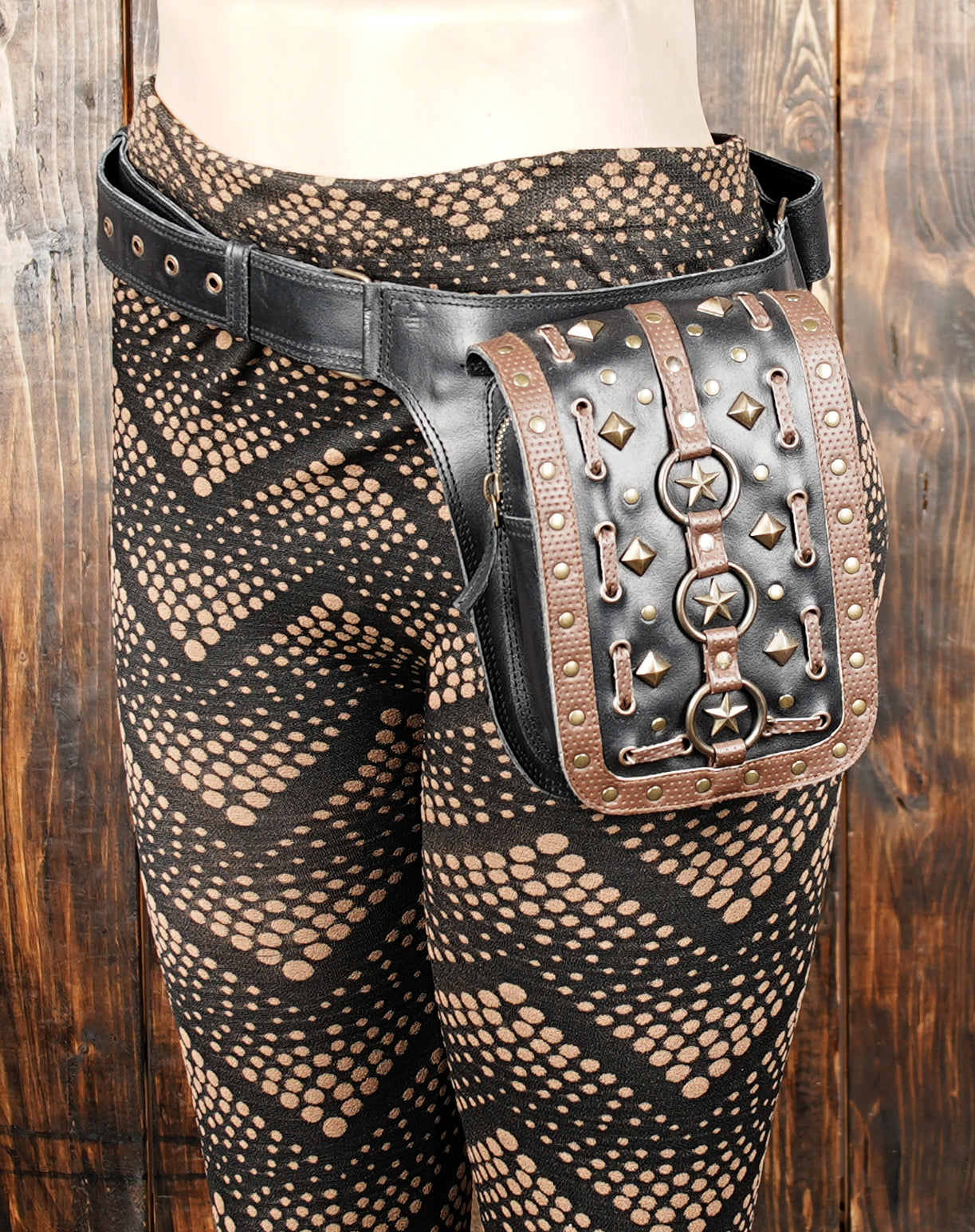Close-up of steampunk belt bag showing star studs and gothic design