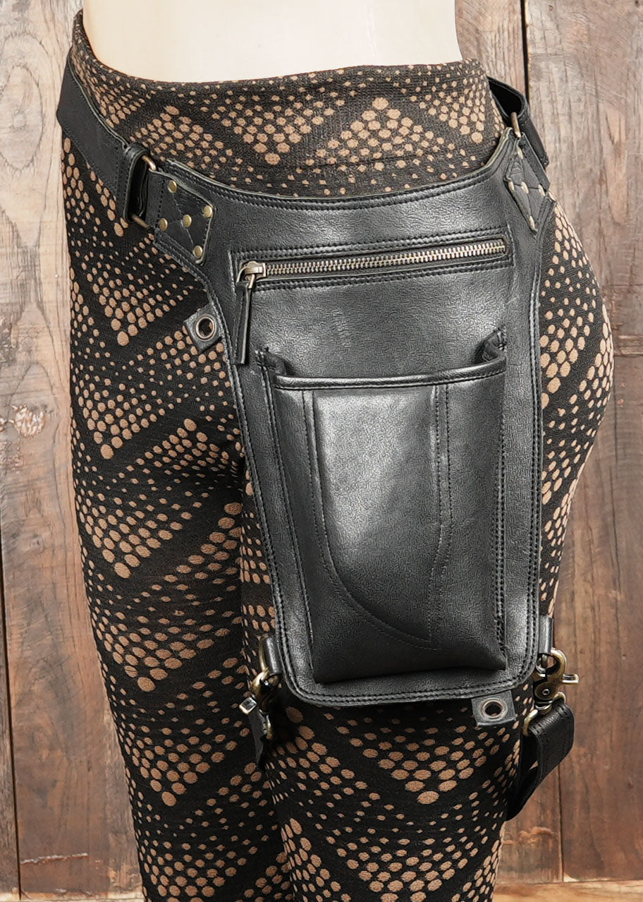 Genuine leather thigh holster with adjustable straps and zipper pouch – perfect for gothic, tribal, boho, and Burning Man outfits.