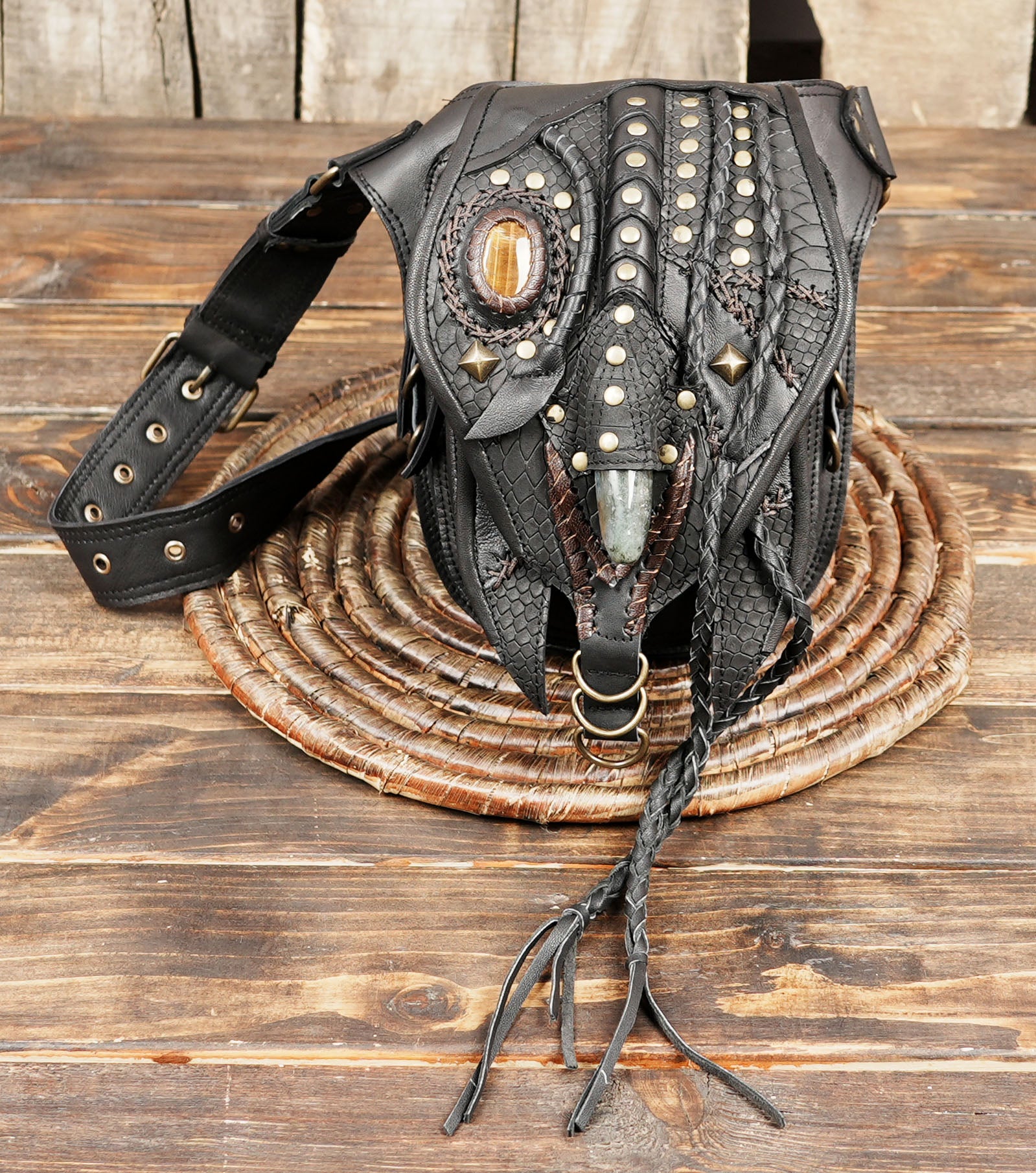 Close-up of gemstone centerpiece on handcrafted leather belt pouch