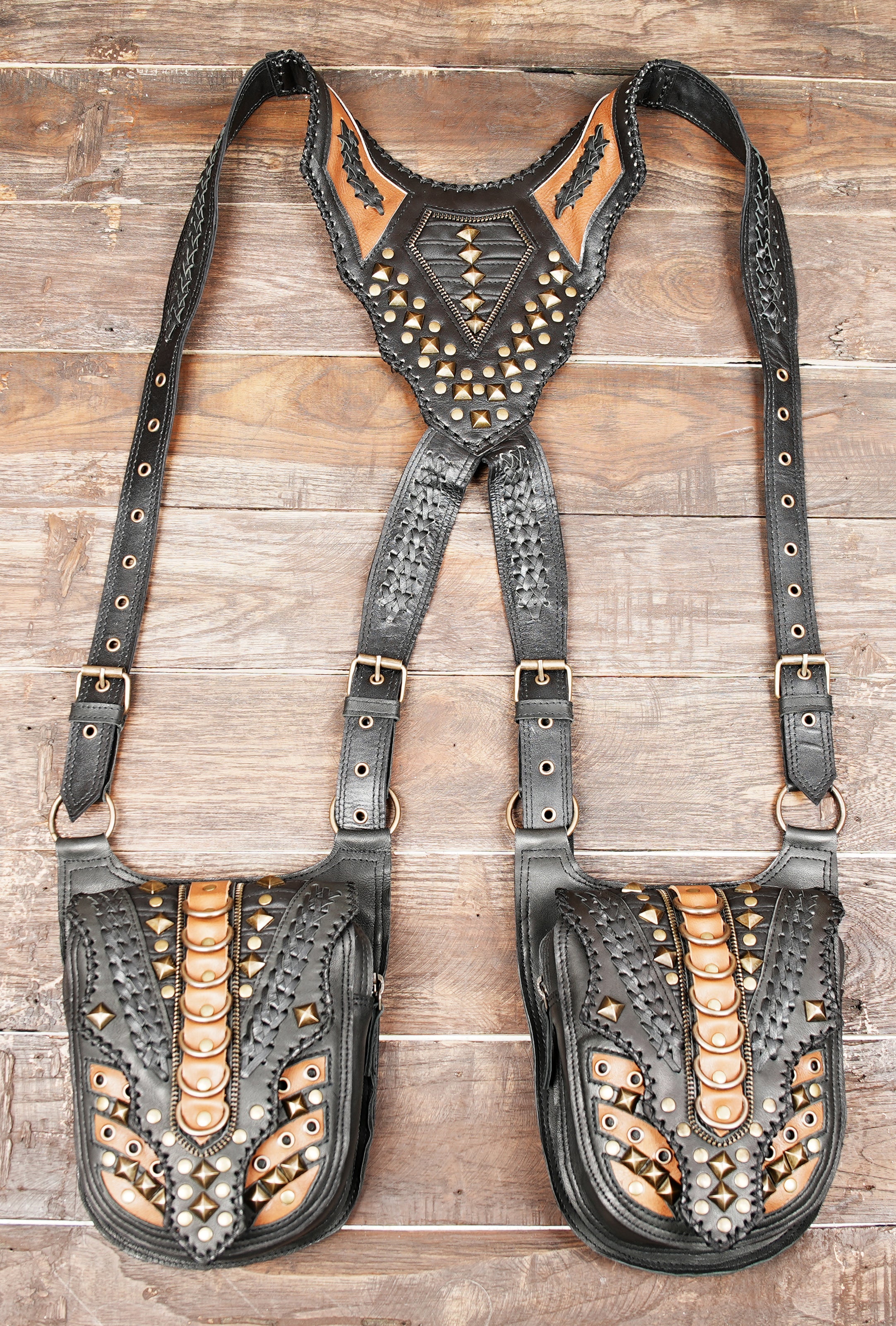 “Boho leather festival holster with dual pockets and intricate tooling”