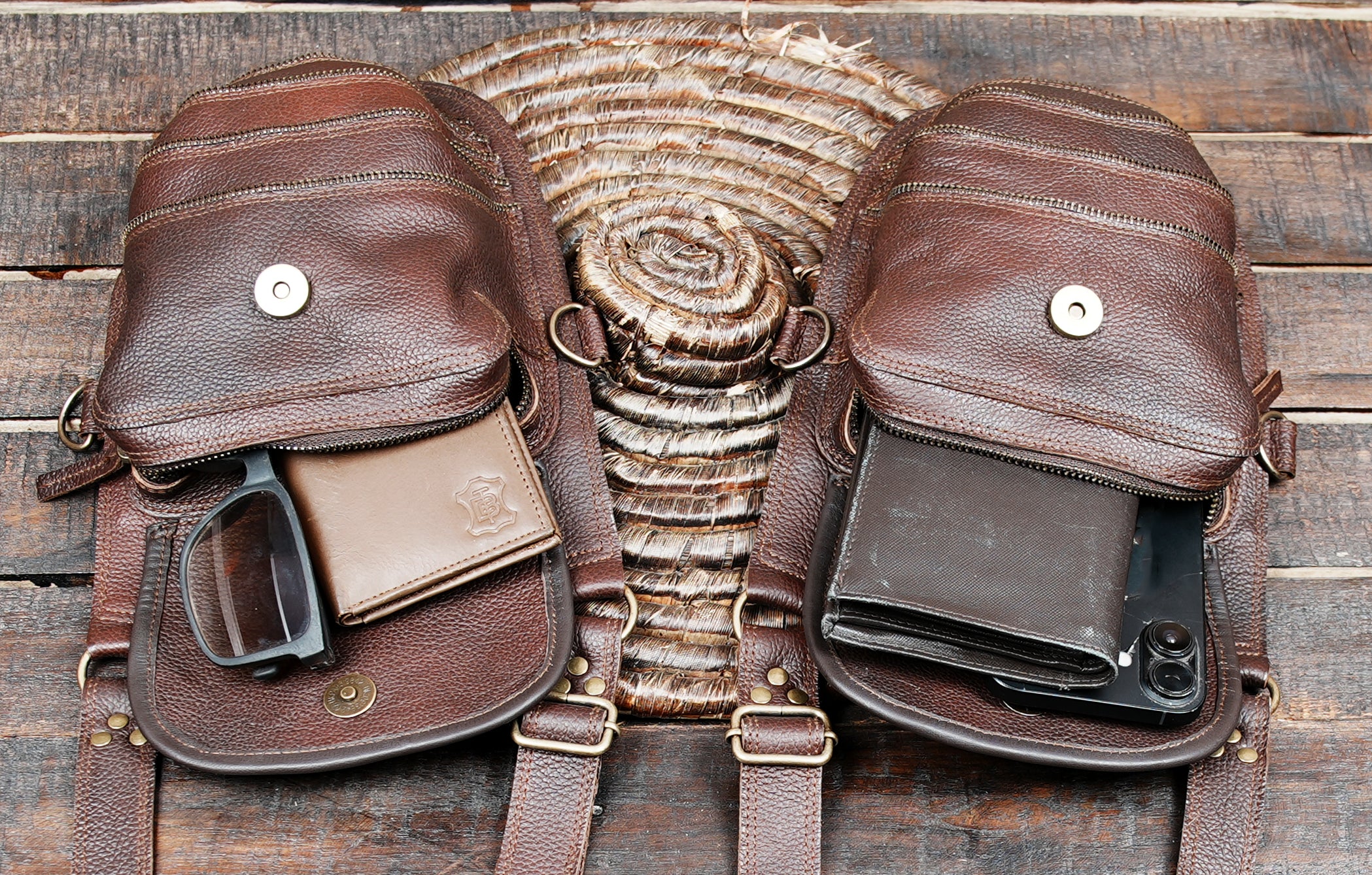 Back view of leather shoulder holster with two zippered pouches