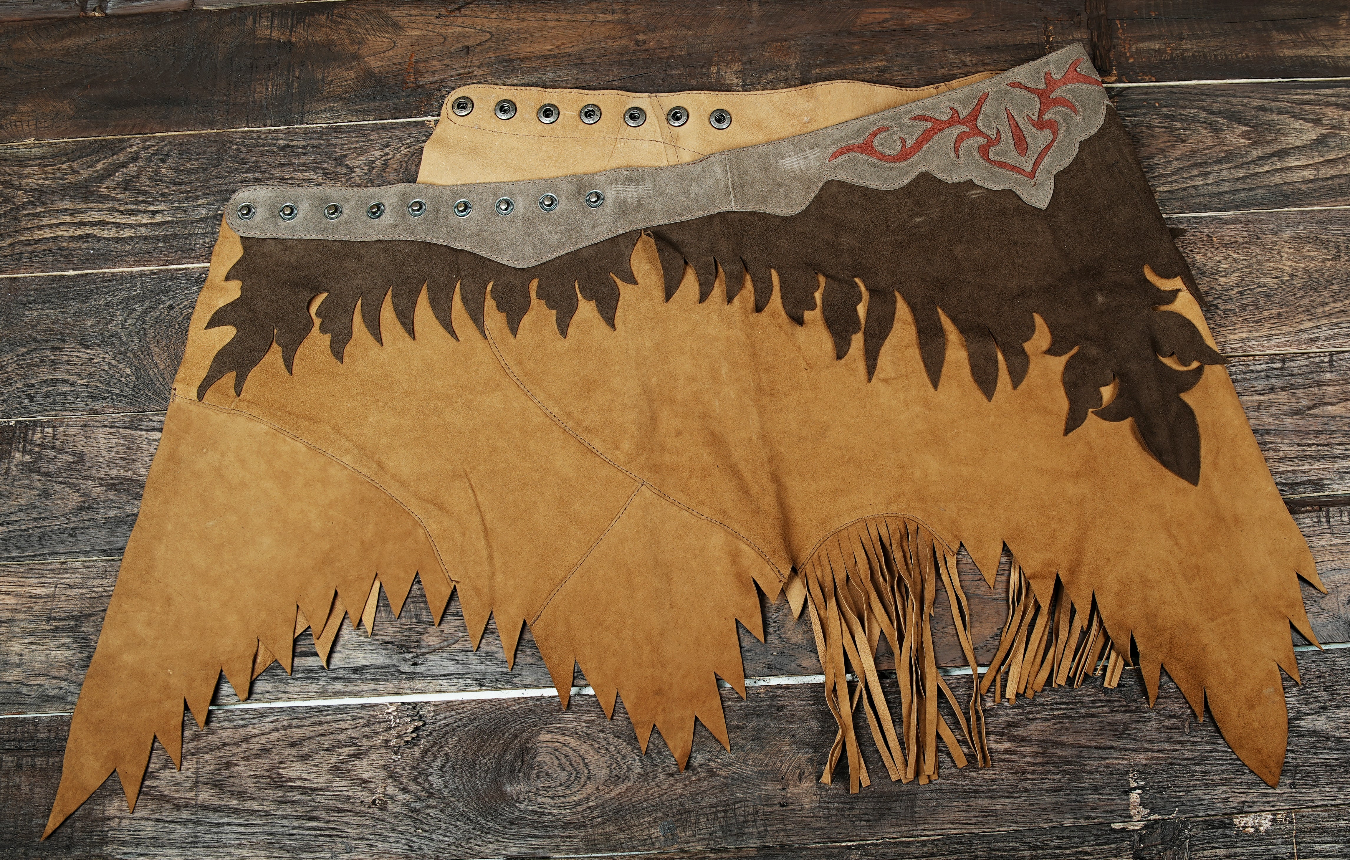 Western-style brown leather skirt with suede texture and decorative stitching