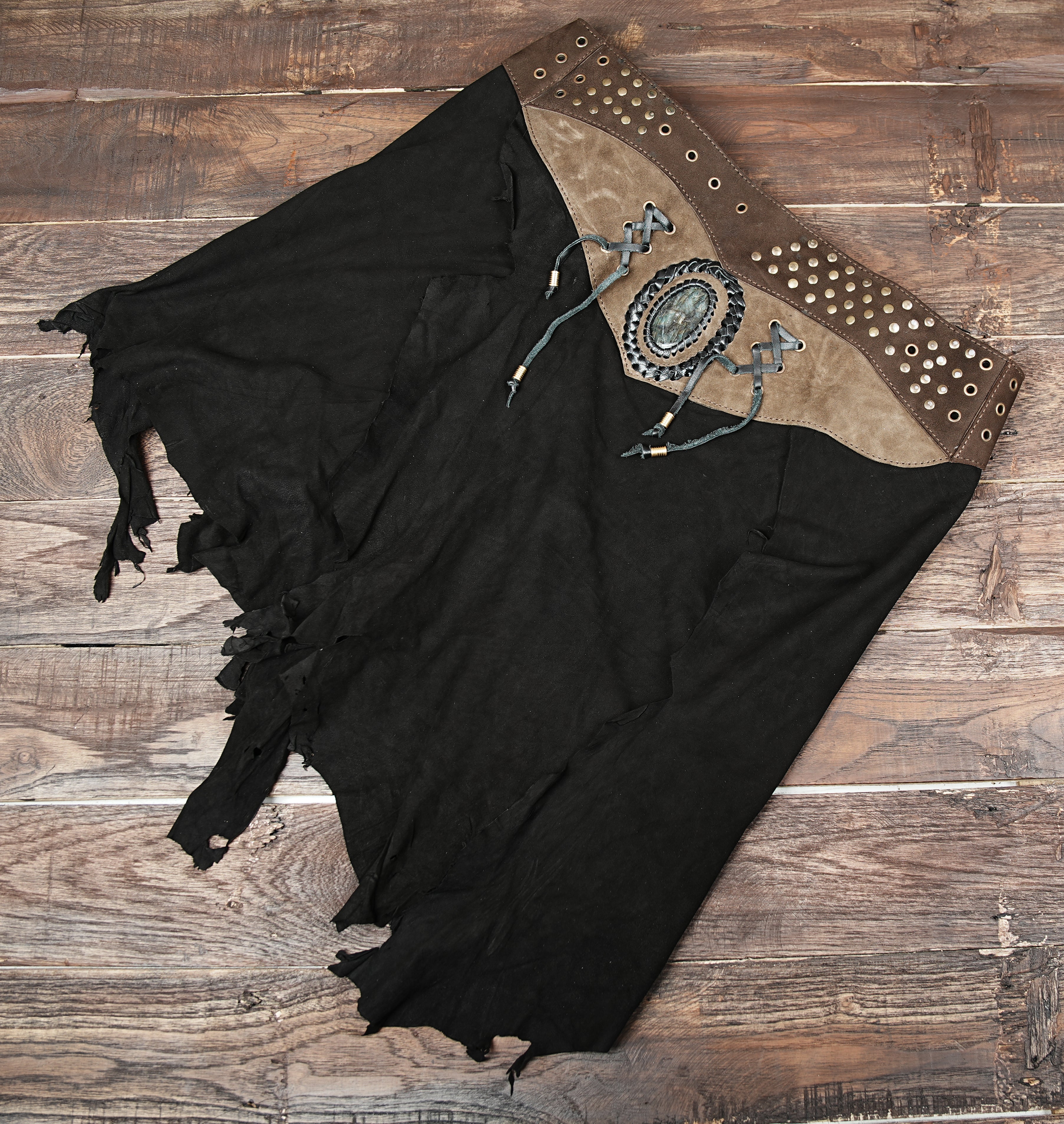 Handcrafted suede leather skirt with gemstone and rivet details, tribal gothic festival wear.”