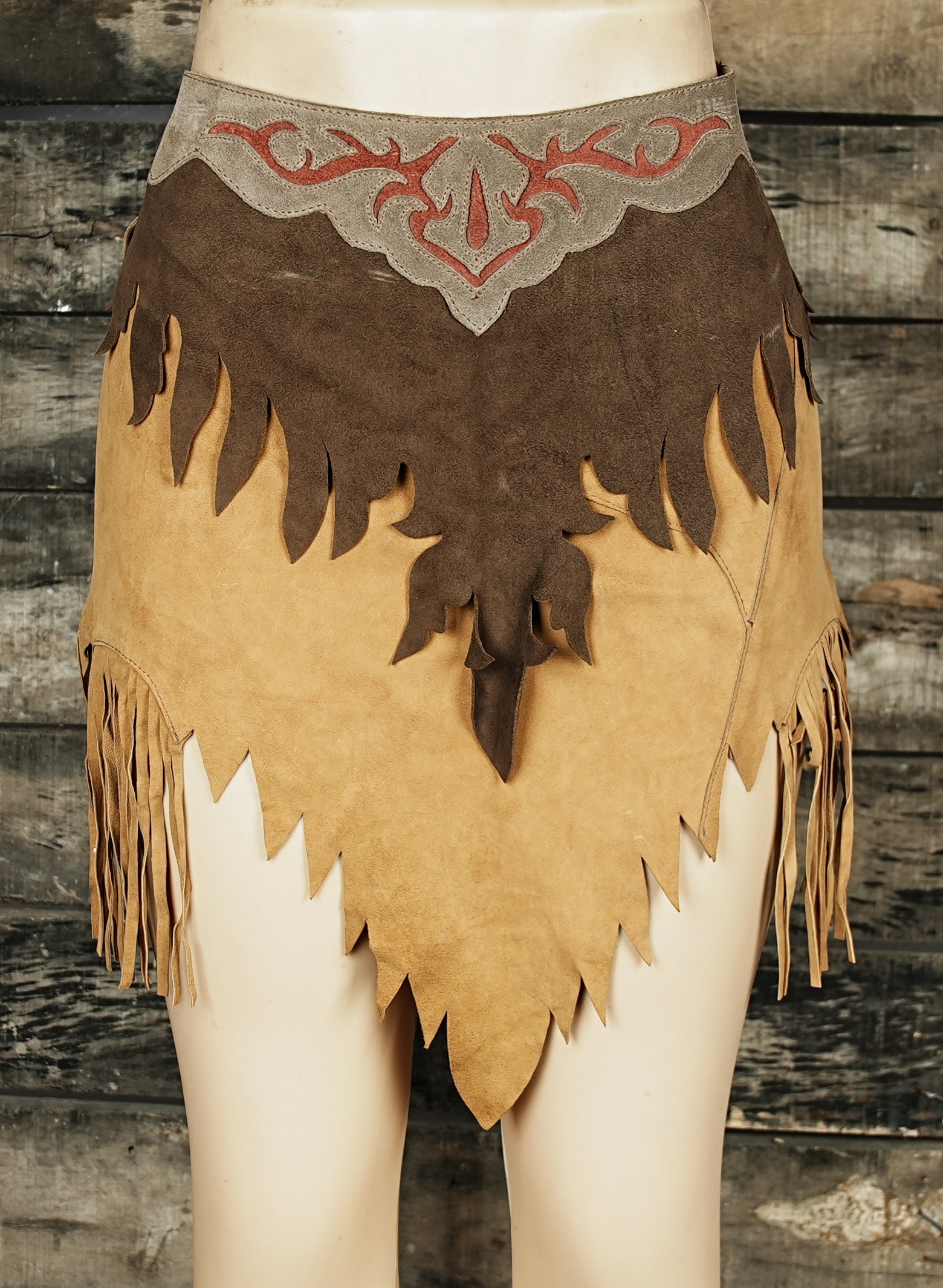 Handcrafted cowboy leather skirt with fringe and embroidered accents