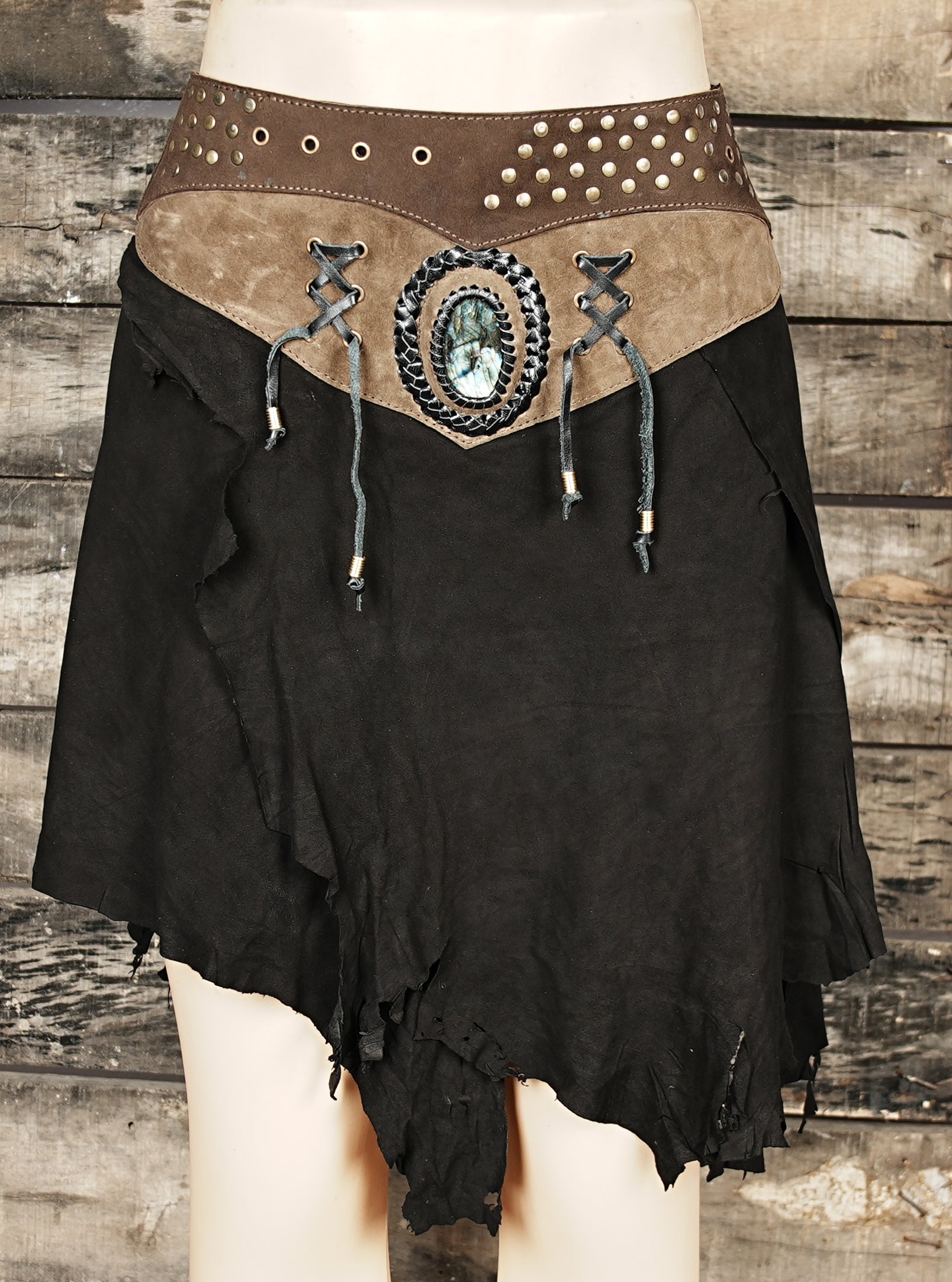 “Black tribal boho skirt with gemstone centerpiece and rustic waistband for gothic cosplay.”