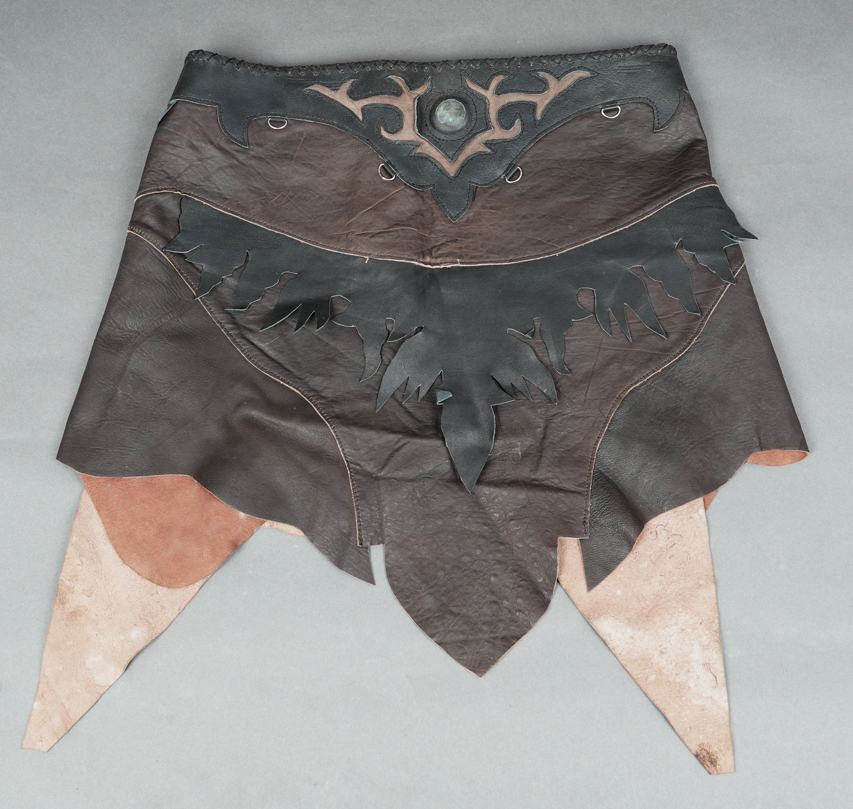 Boho-chic leather waist belt skirt with natural texture and shape