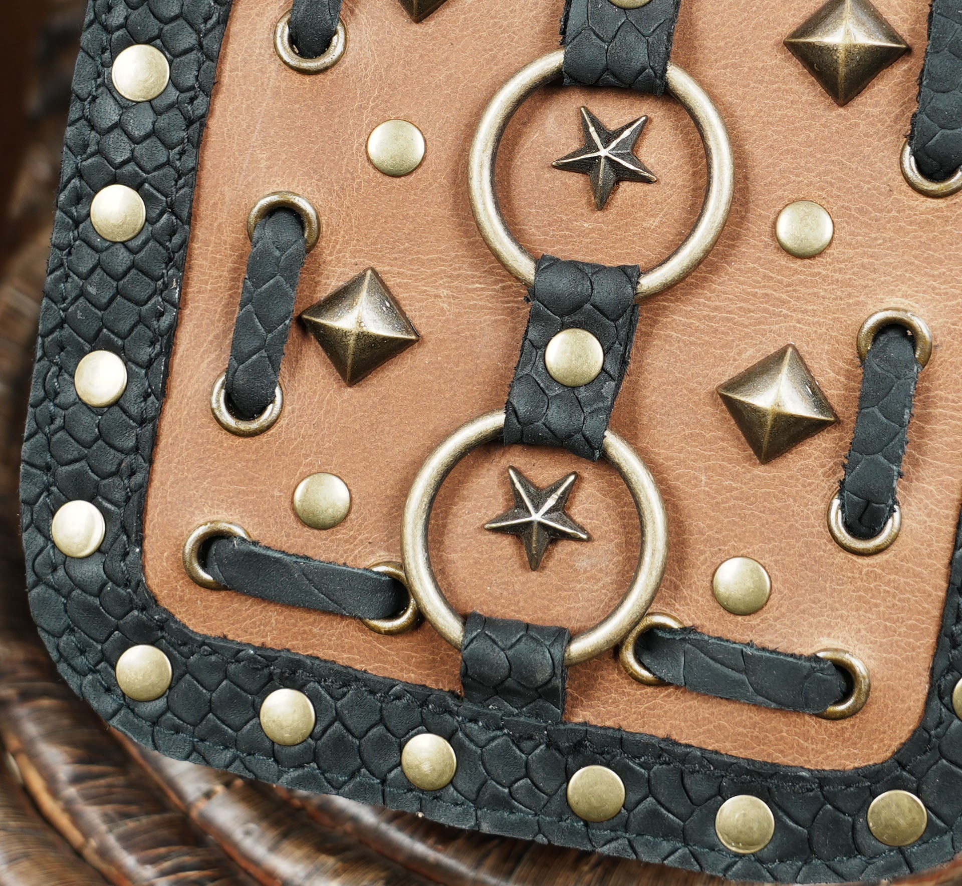 Stylish festival hip bag belt with decorative star studs and lacing.