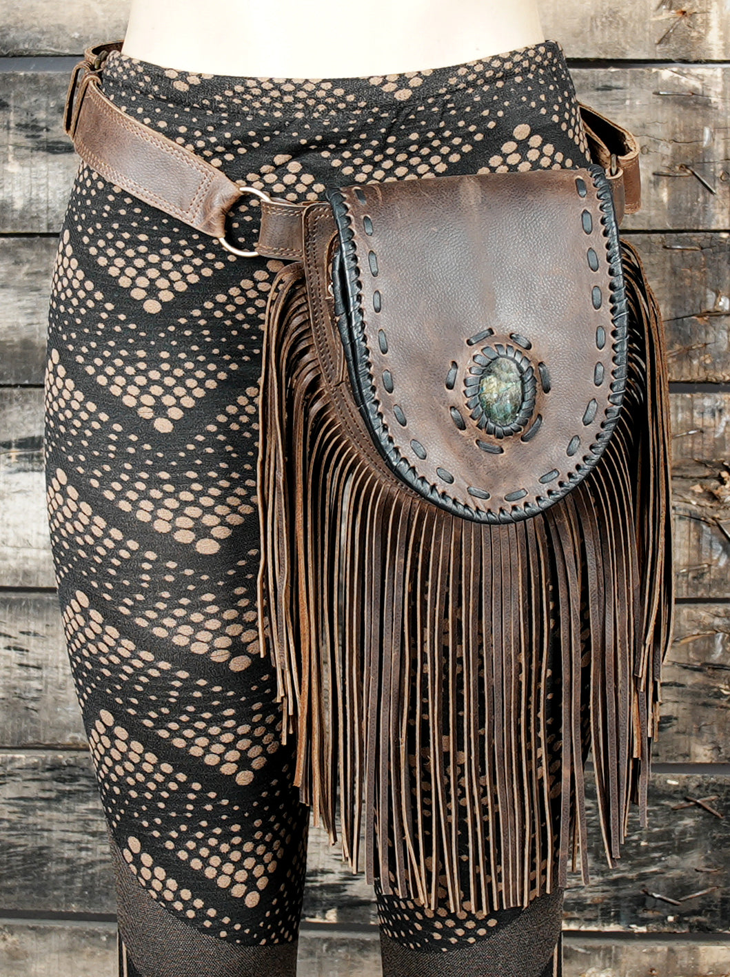 Festival-ready brown leather hip pouch with long fringe