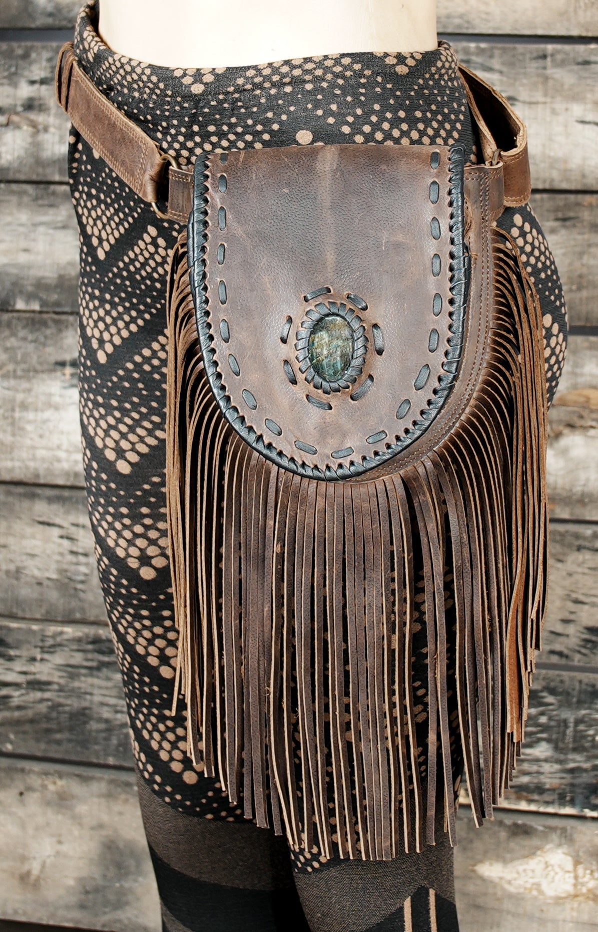 Cowgirl-style brown leather fanny pack with gemstone centerpiece