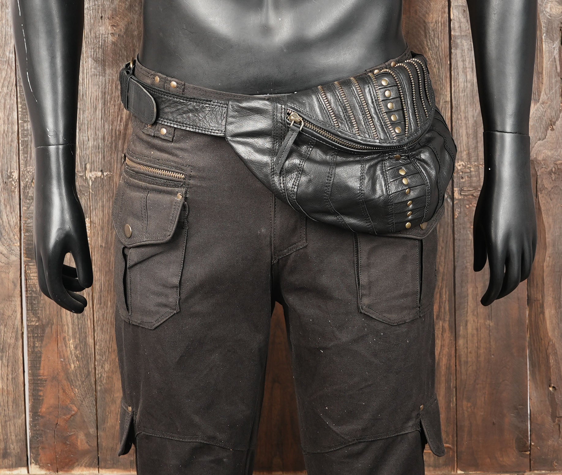 Steampunk waist and hip belt bag with decorative studs and zippers.