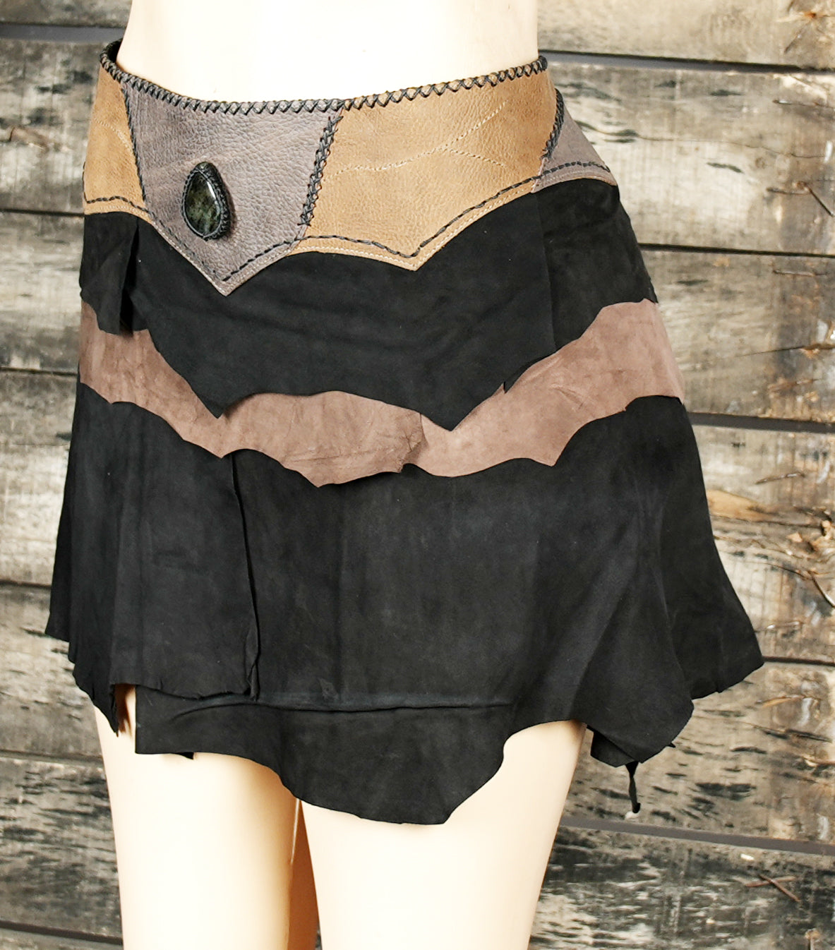 Handcrafted leather skirt with stone detail on waistband